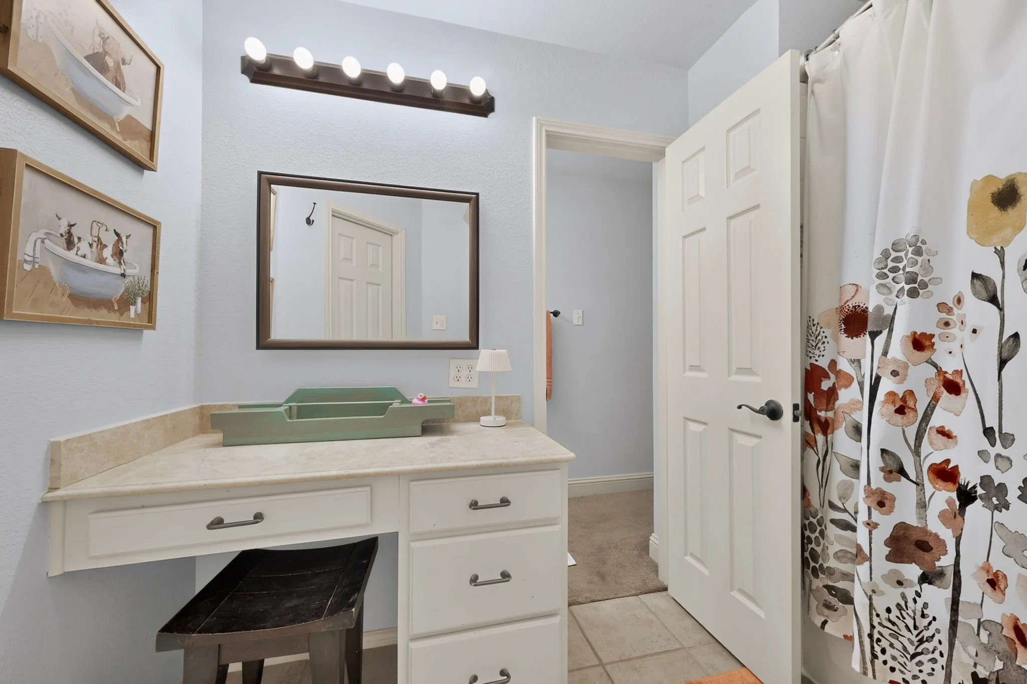 MAKEUP VANITY INSIDE TUB AREA OF JACK AND JILL BATHROOM