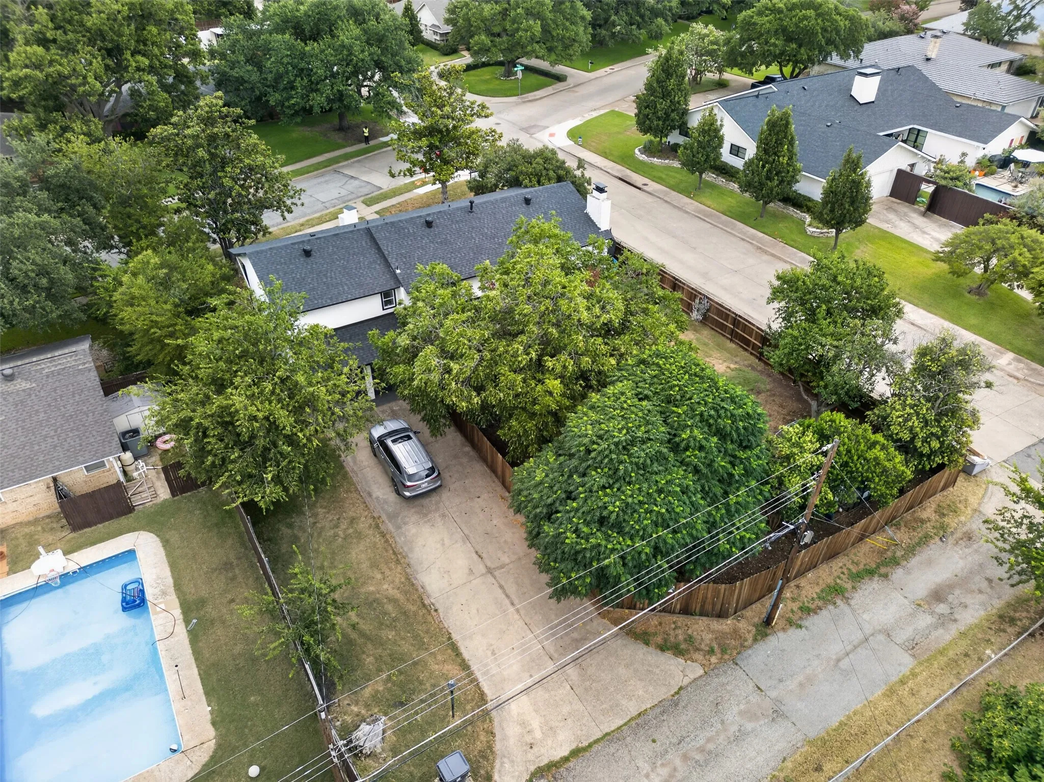 Treed back yard with rear entry garage.