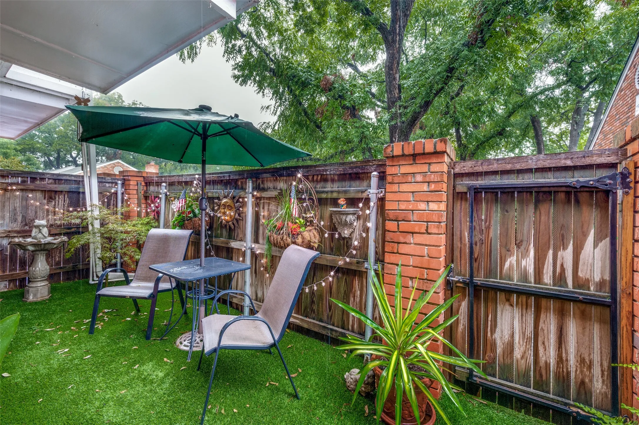 Back Patio with Wood and Brick Fence