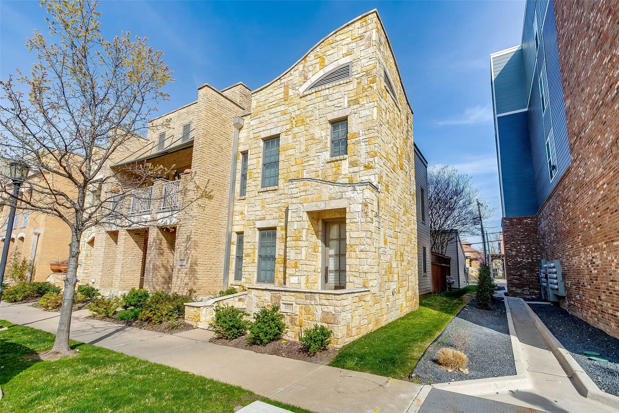 Stone veneer exterior featuring varied textures and window styles