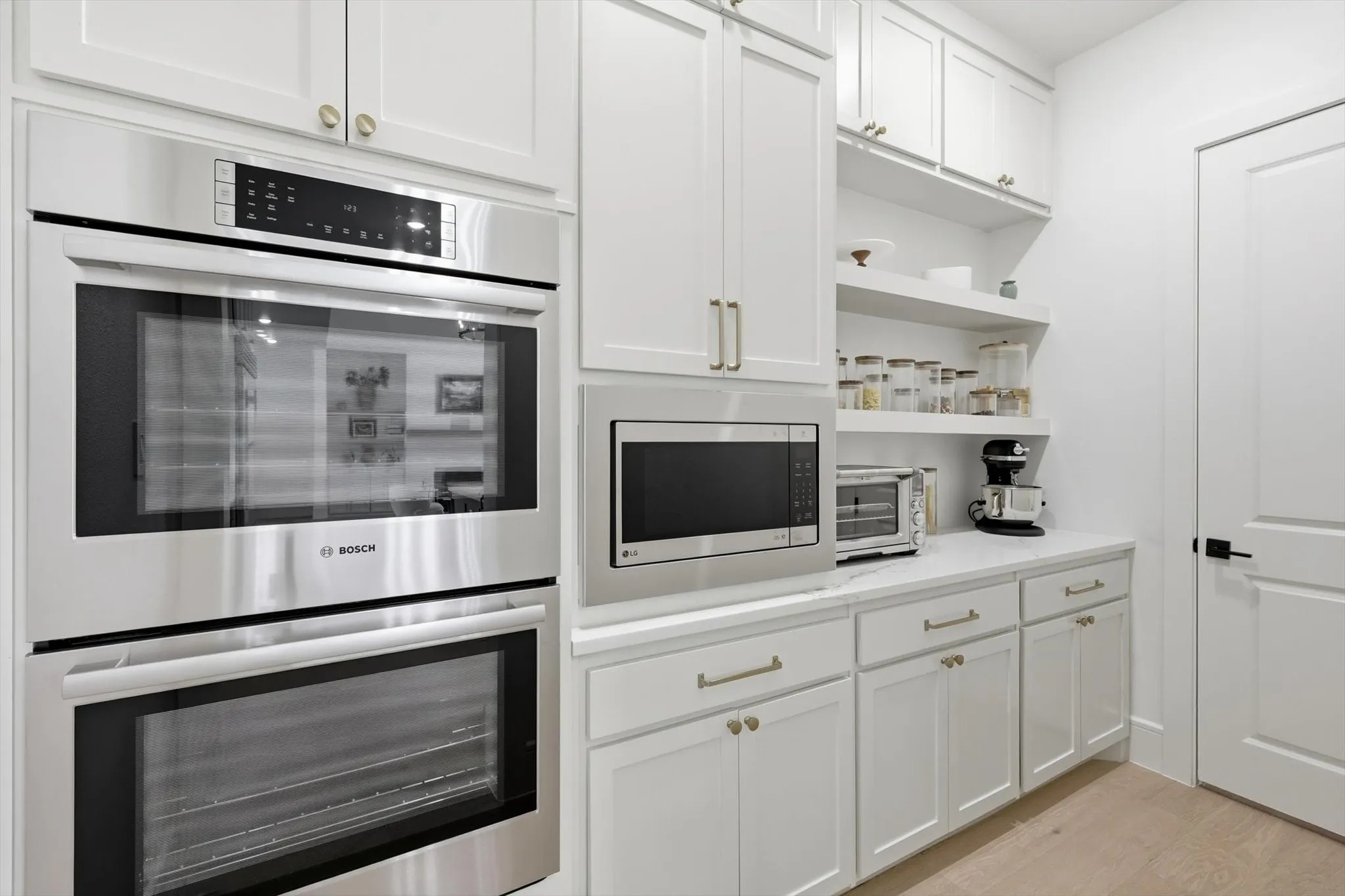 The Butler pantry, or back kitchen provides more prep and cooking area plus storage.