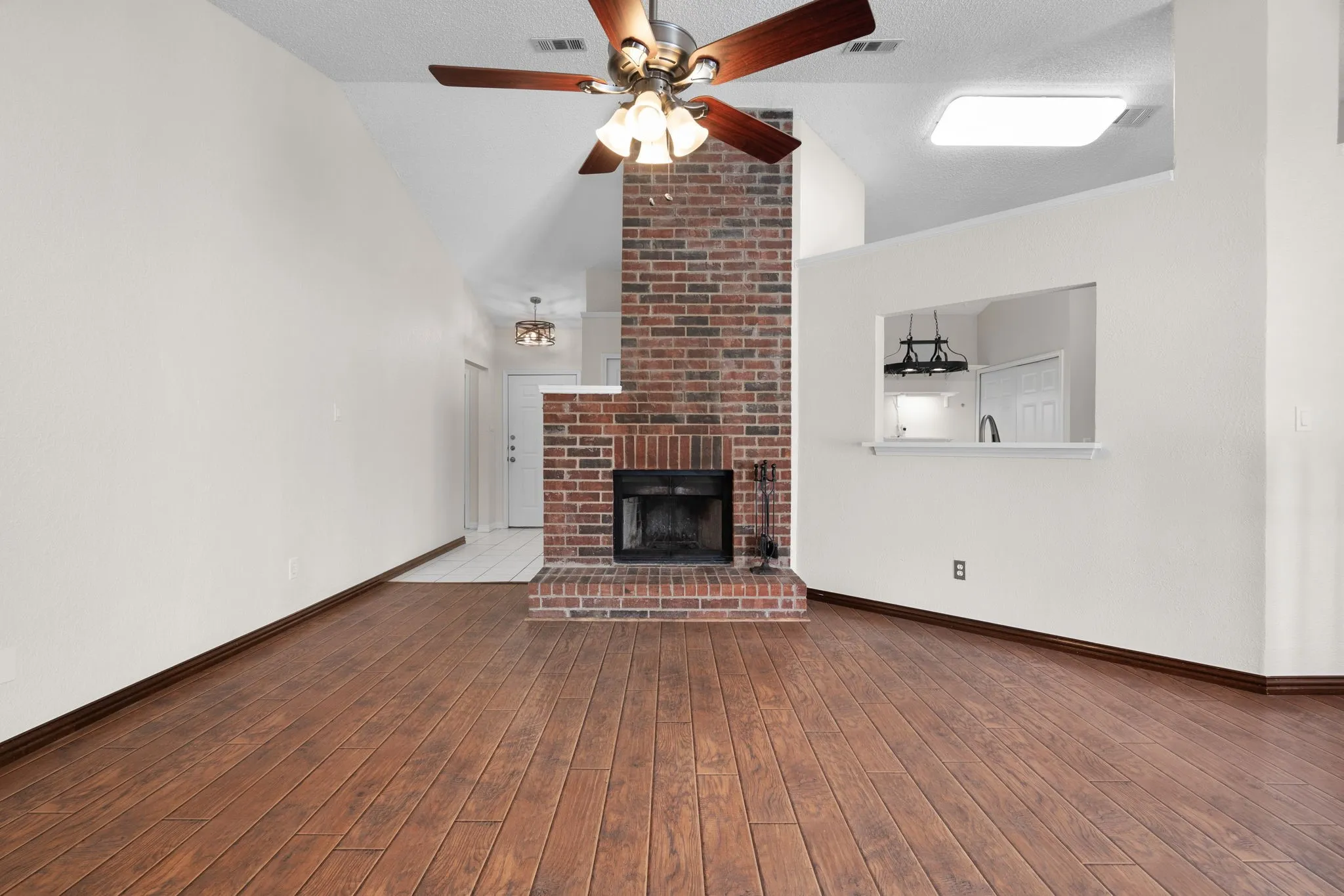 The living room has lots of natural light at the center of the home.