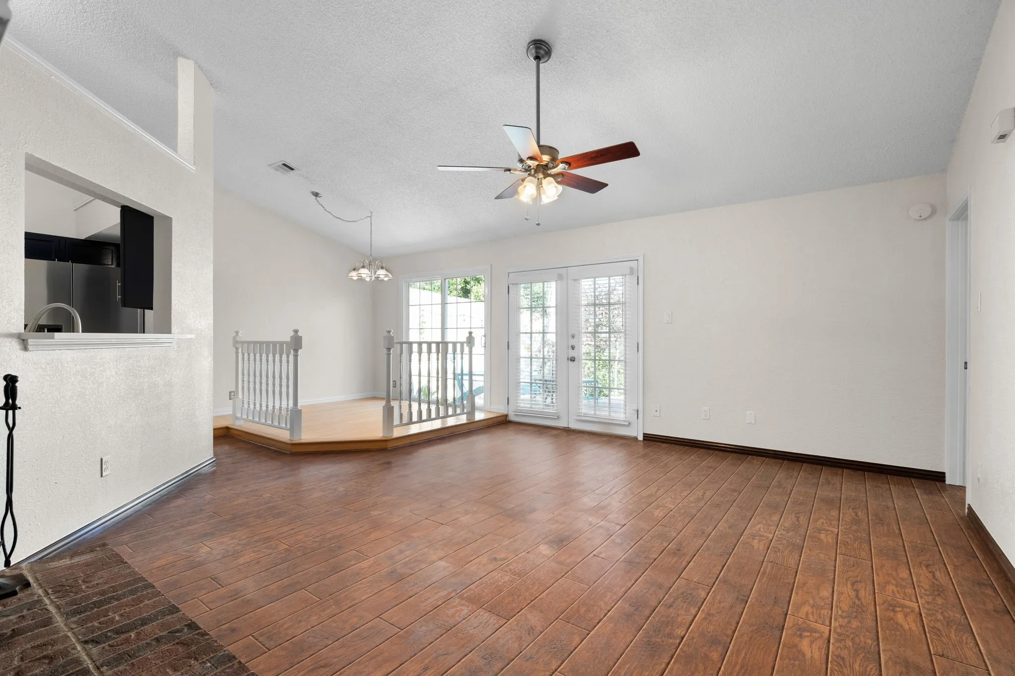 Another view of the living and dining areas that overlook the back patio.