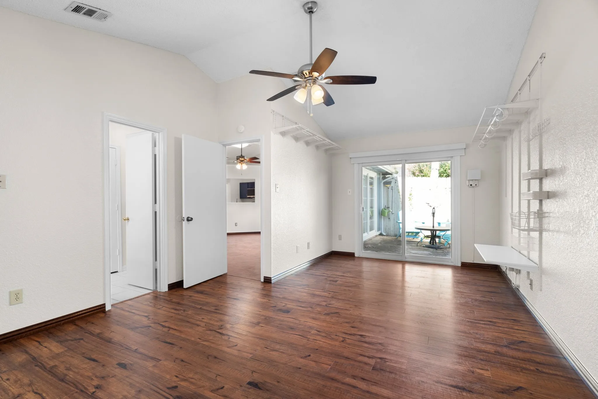 The primary bedroom has a large sitting area that leads to the patio.