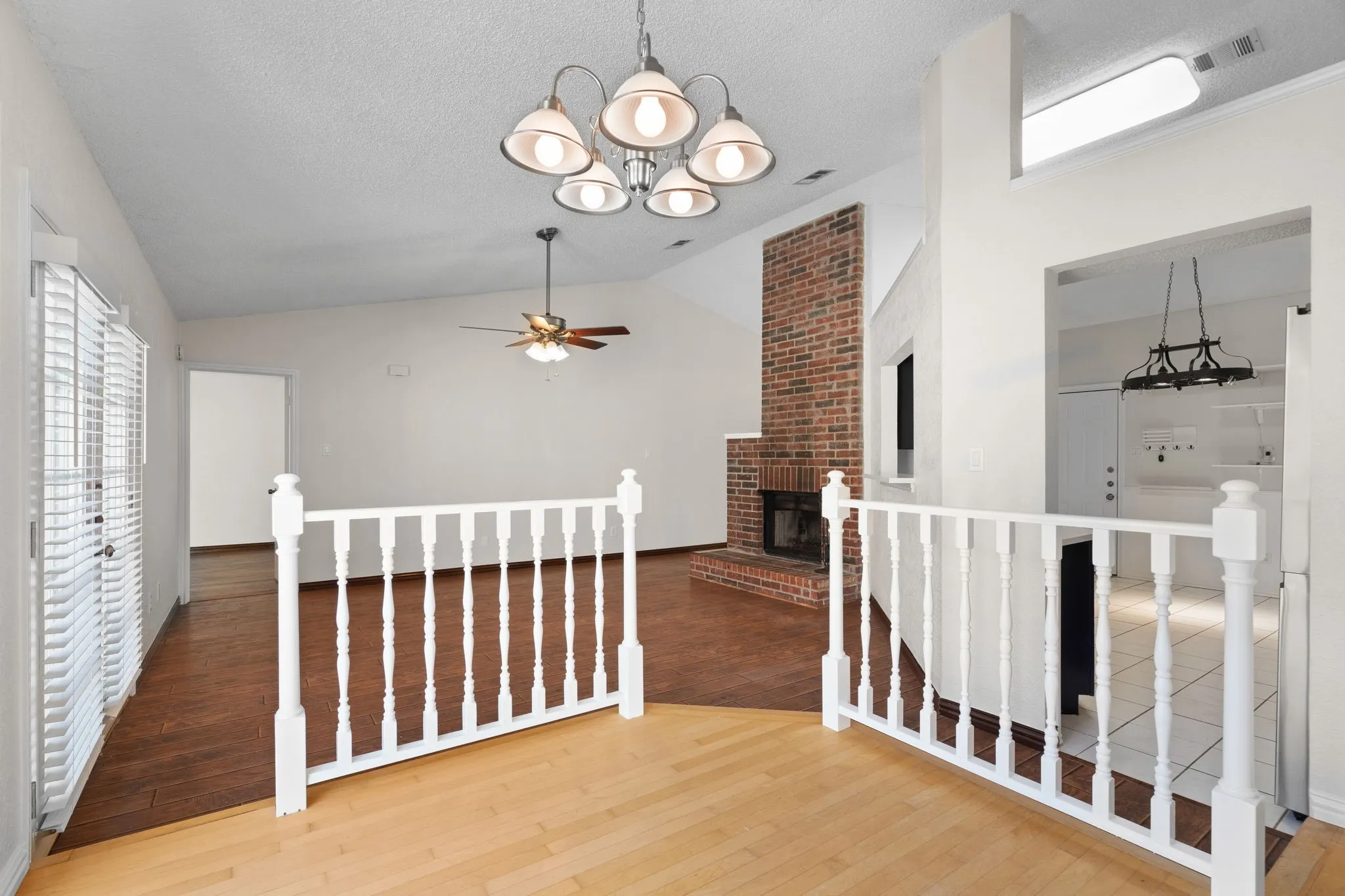 A view of the living room from the dining area. The kitchen is to the right.