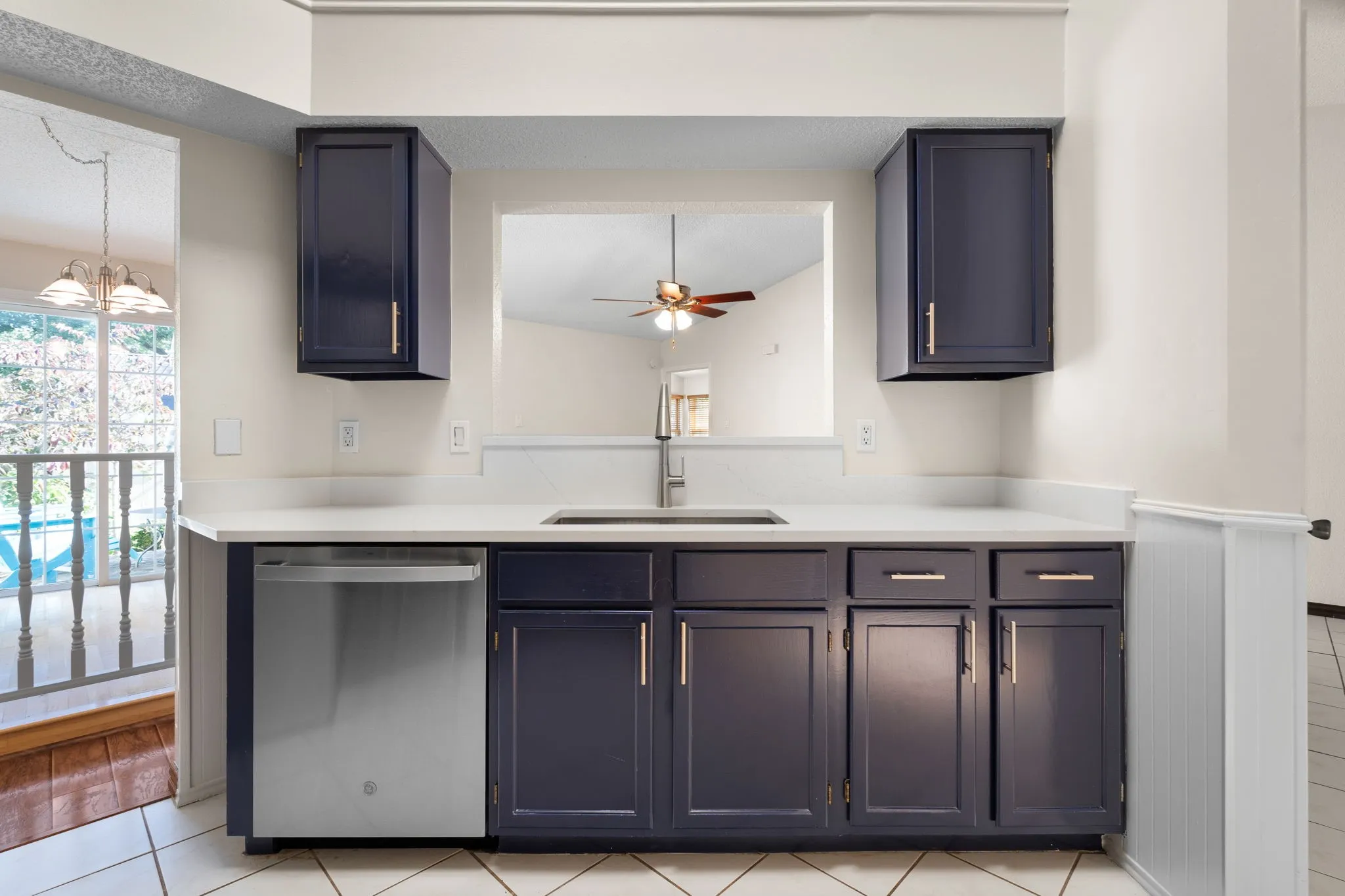 The kitchen has a pass through to the living room.