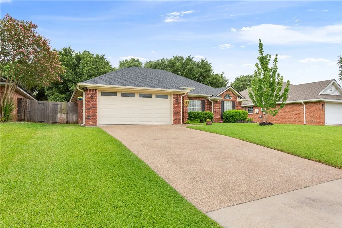 Brick exterior with an attached two-car garage