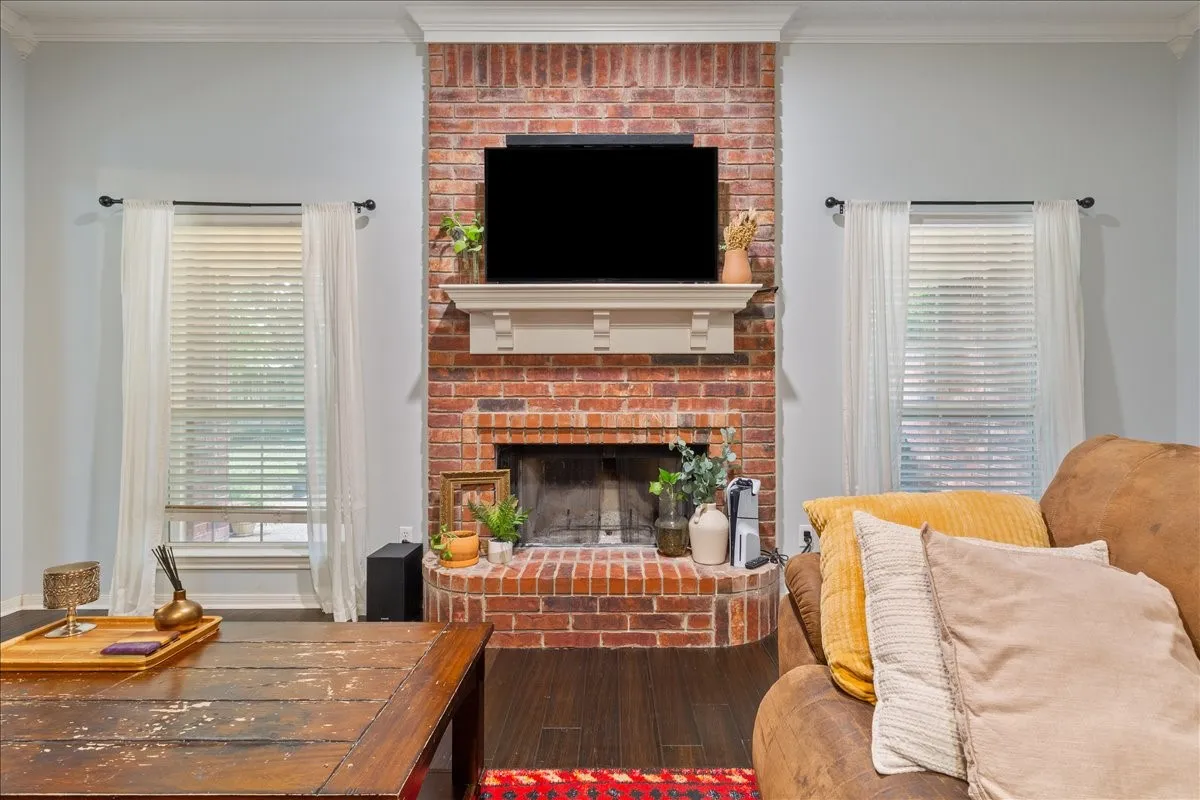 Brick fireplace with a white mantle