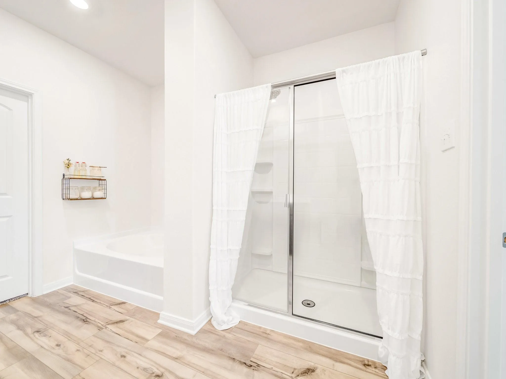 Shower stall with clear glass enclosure and sliding door