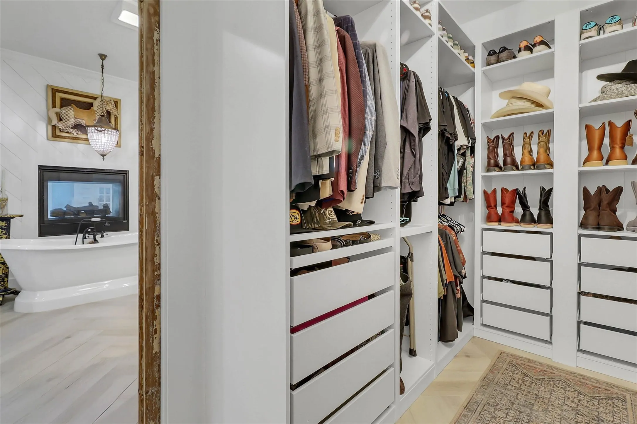 Custom closet system featuring shelving, hanging rods, and integrated drawers