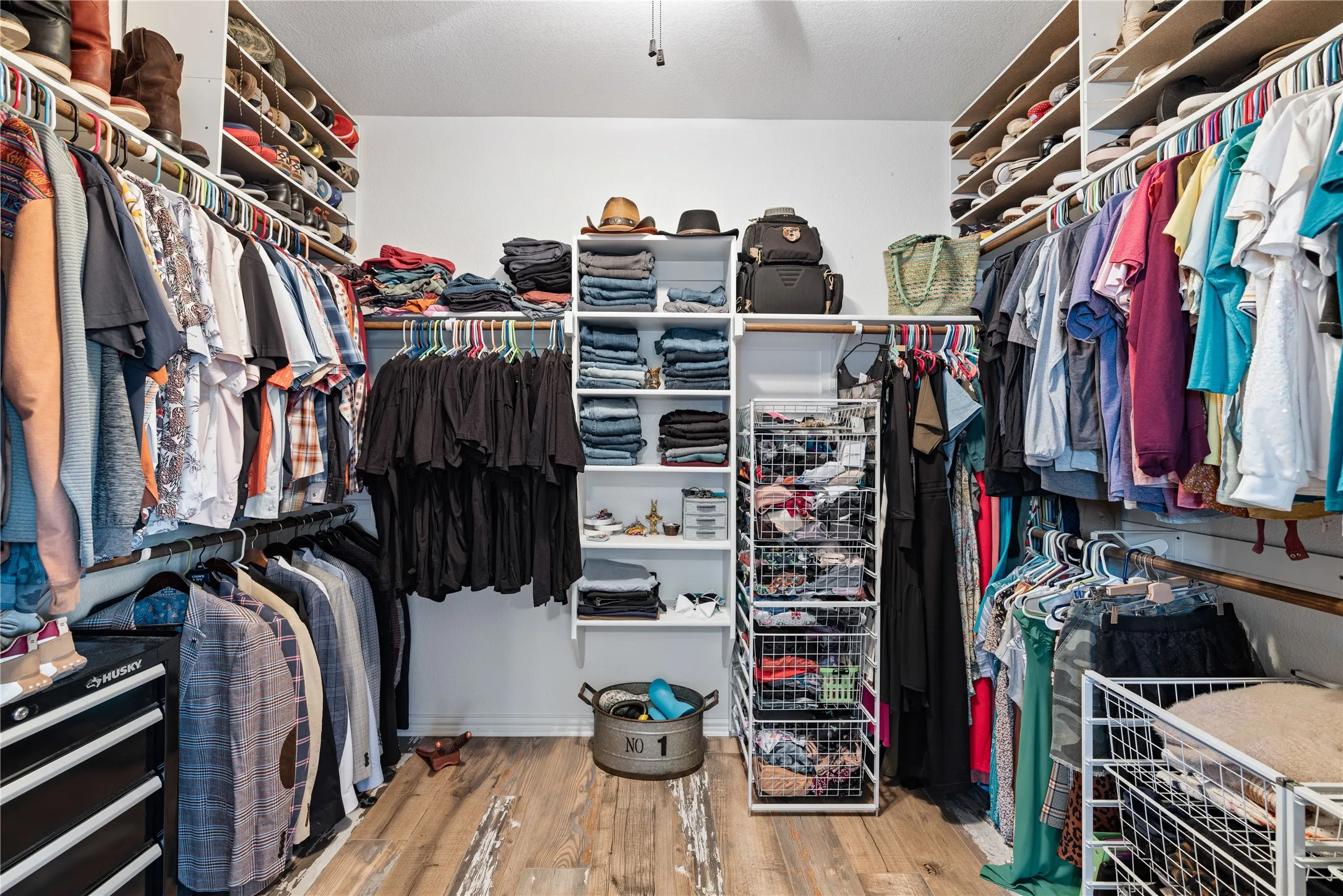 Spacious closet with light wood-type flooring