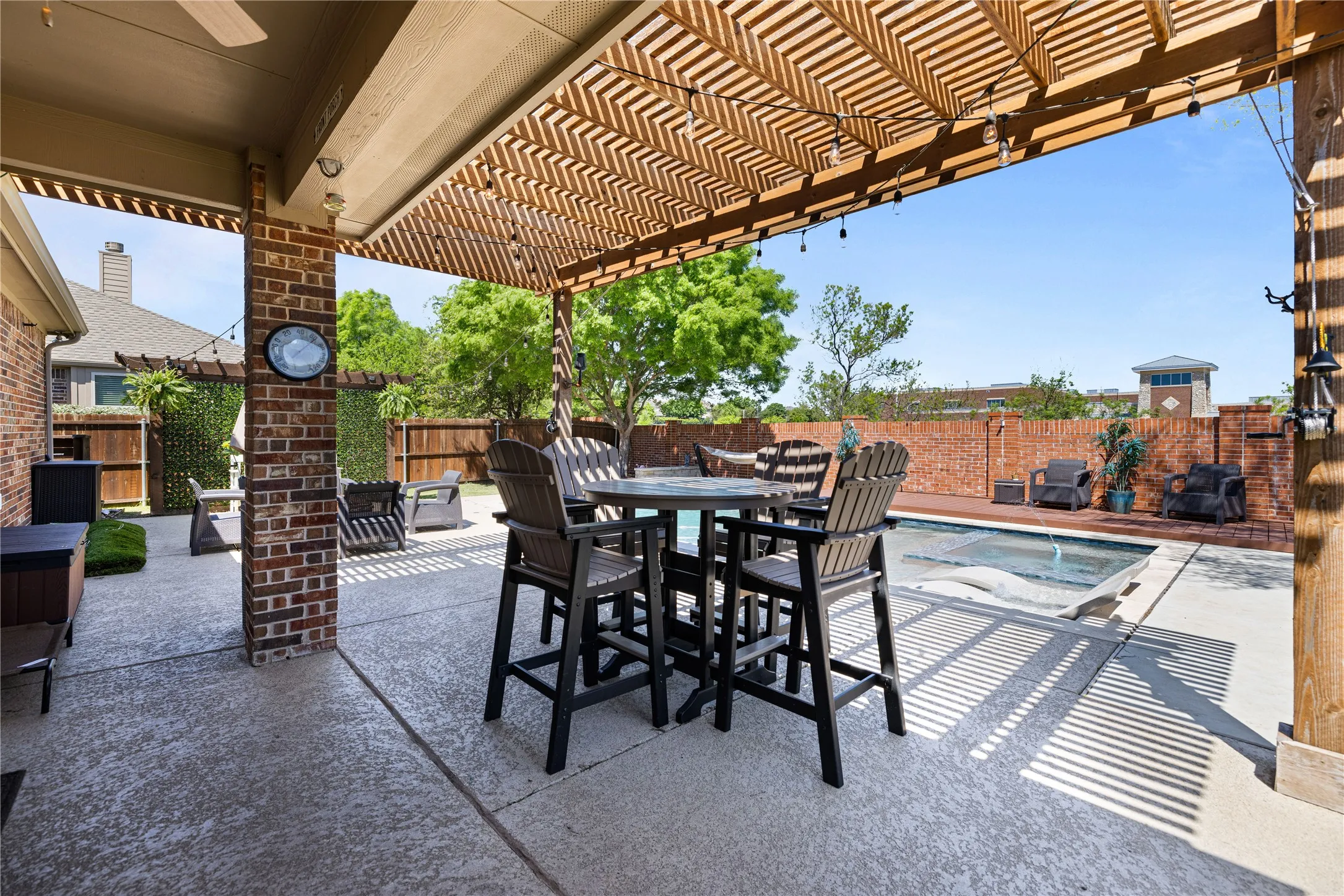 View of patio featuring a pergola and a fenced in pool