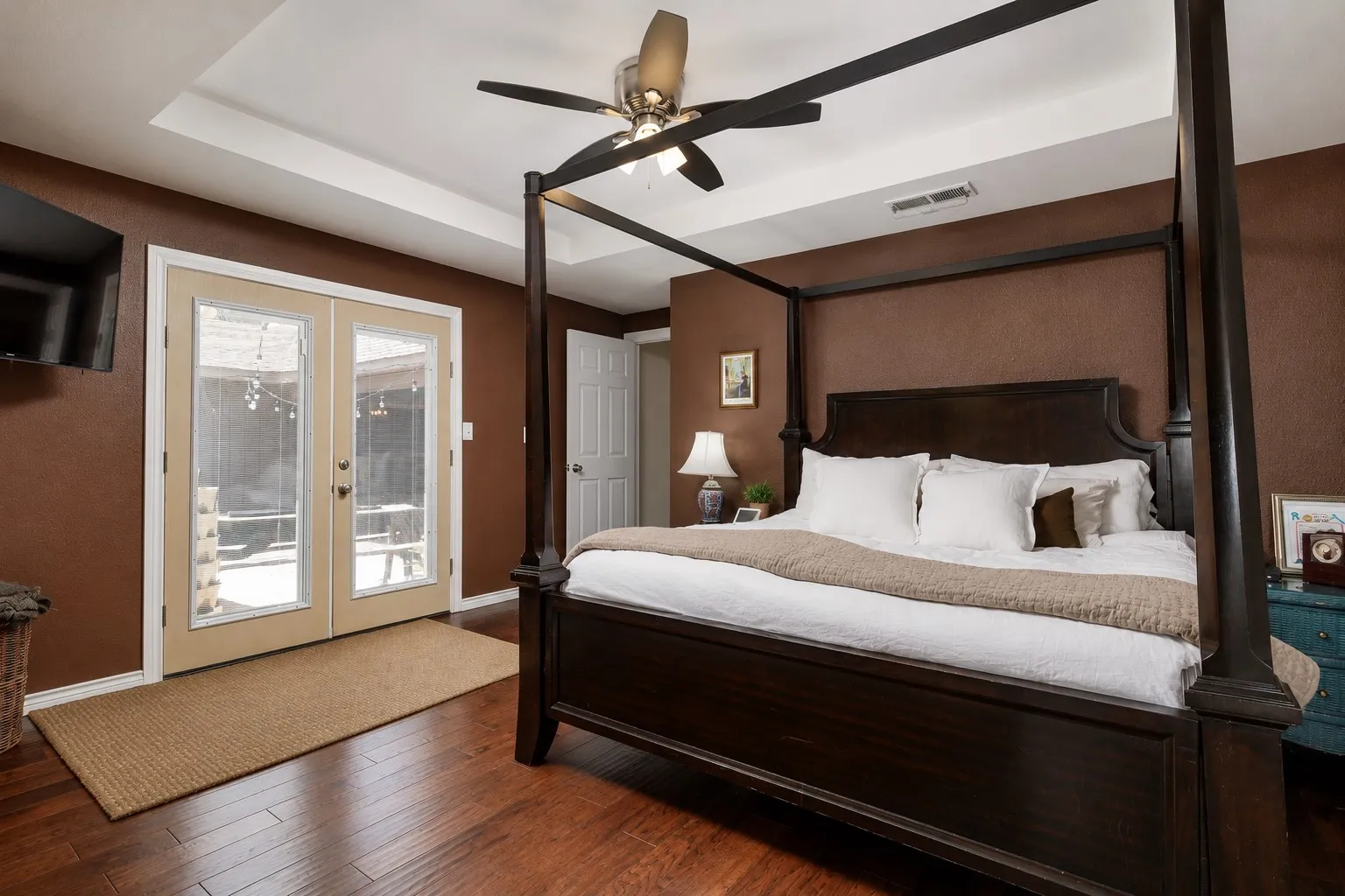 main level primary bedroom with patio access