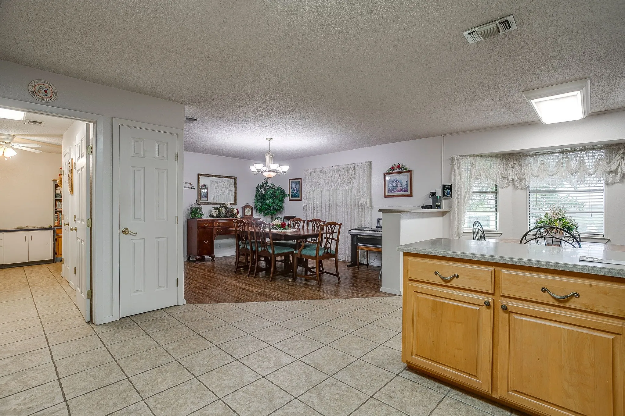Kitchen, dining area and entry to oversized laundry room