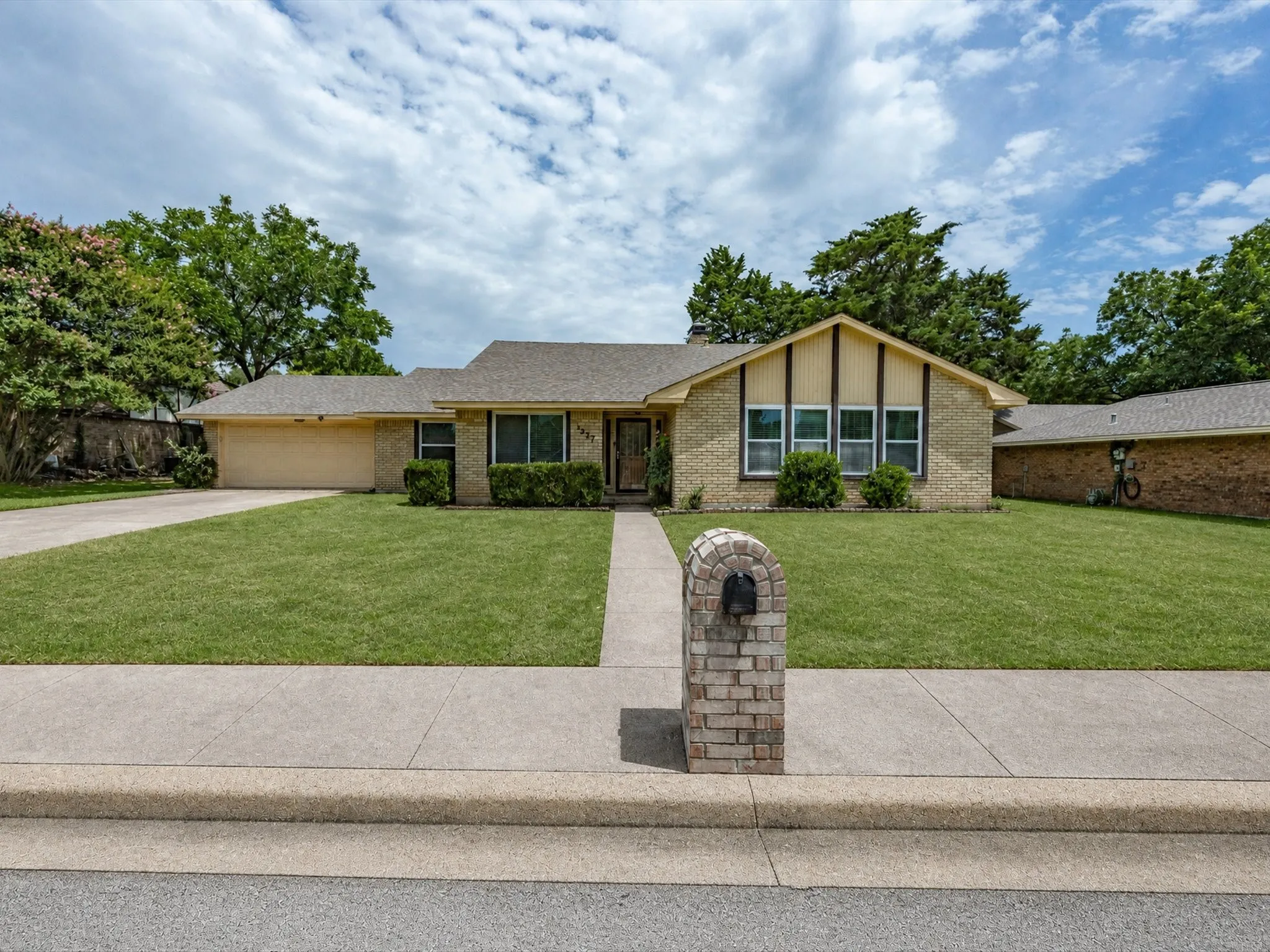 Brick exterior with a gabled roofline