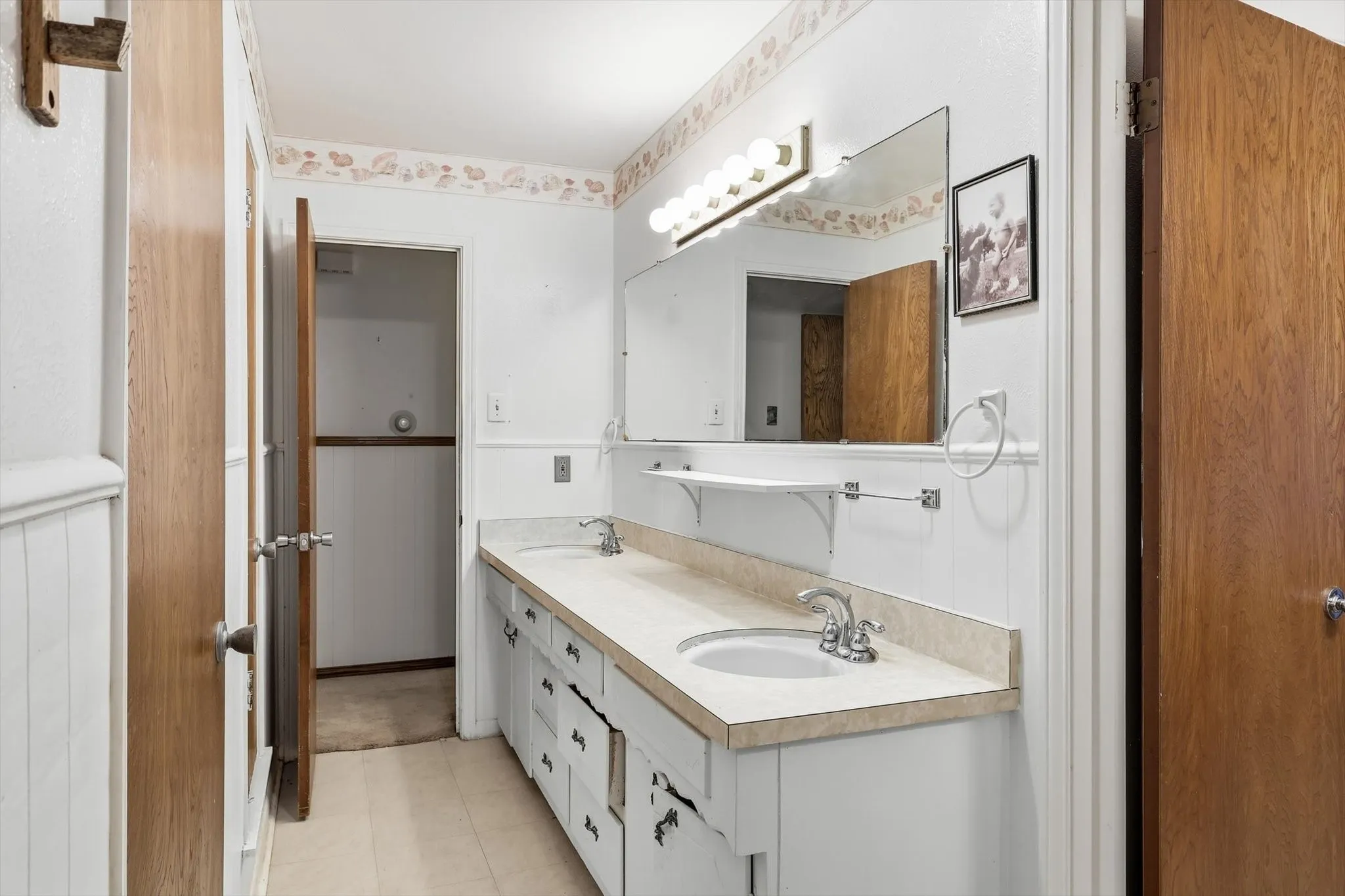 Double vanity with dual undermount sinks and chrome faucets
