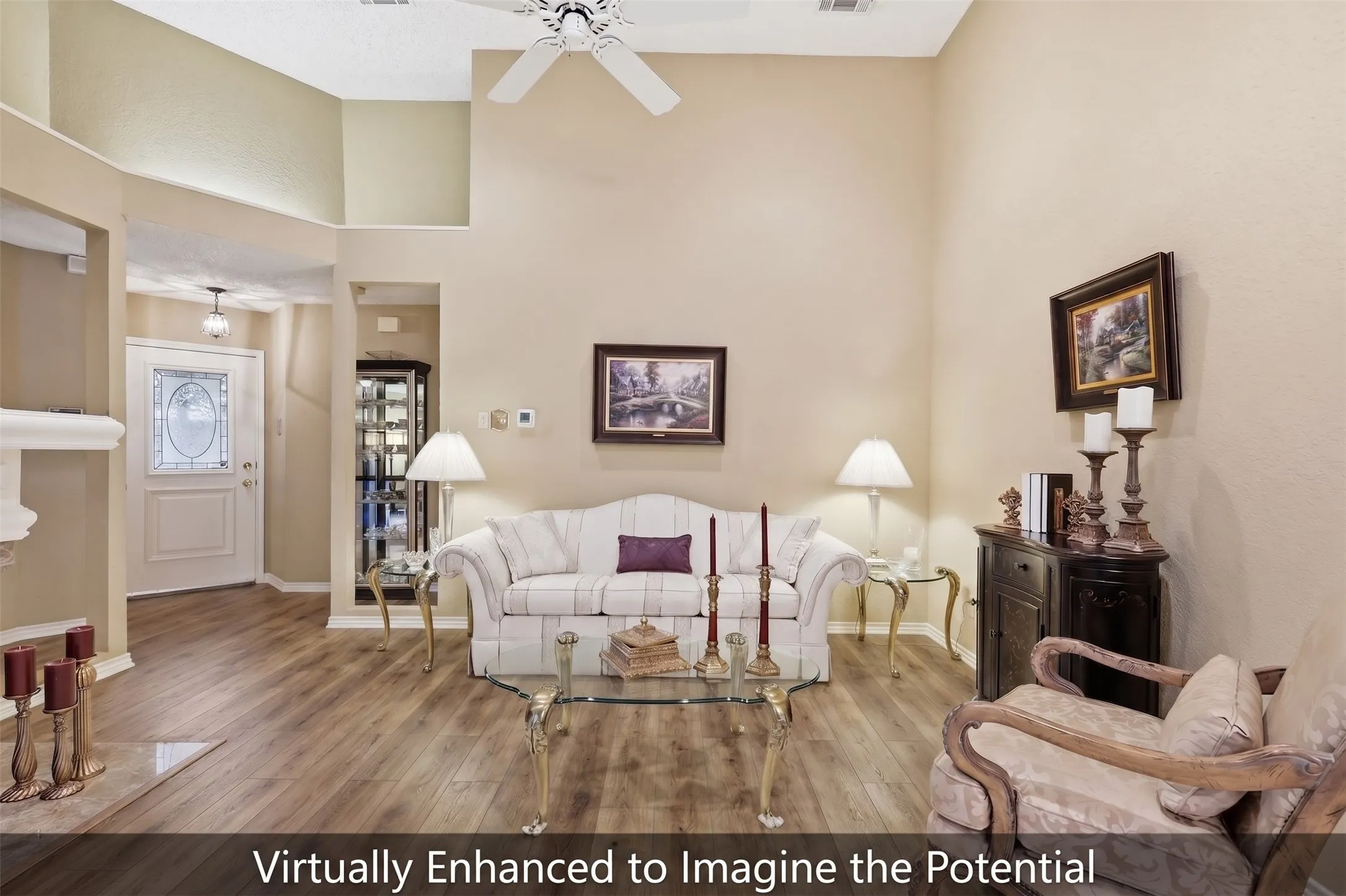 Vaulted ceilings with a ceiling fan, wood-finish flooring, and a decorative front entry door with leaded glass