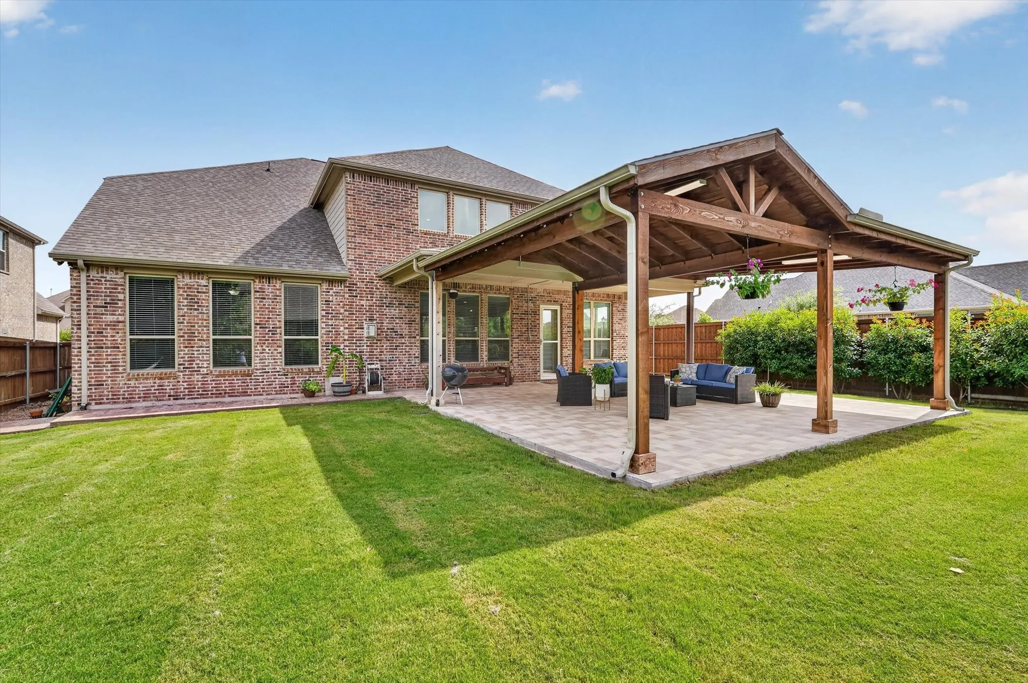 Gorgeous extended covered patio. Overlooks the yard with space for pool.