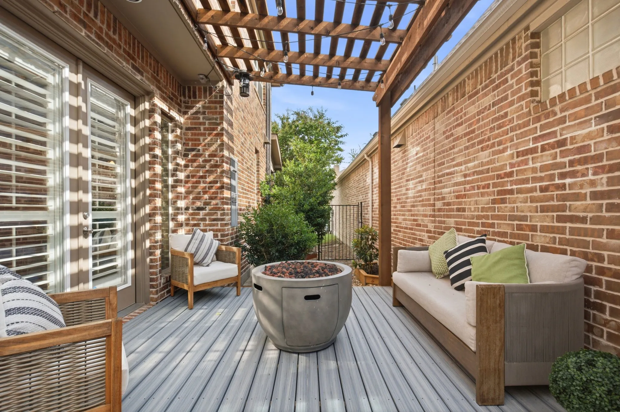 Extend your living space outdoors to a beautifully designed pergola-covered patio featuring an expansive fiber cement composite deck built for both style & lasting performance. This low-maintenance, durable surface provides the perfect foundation for outdoor lounging.