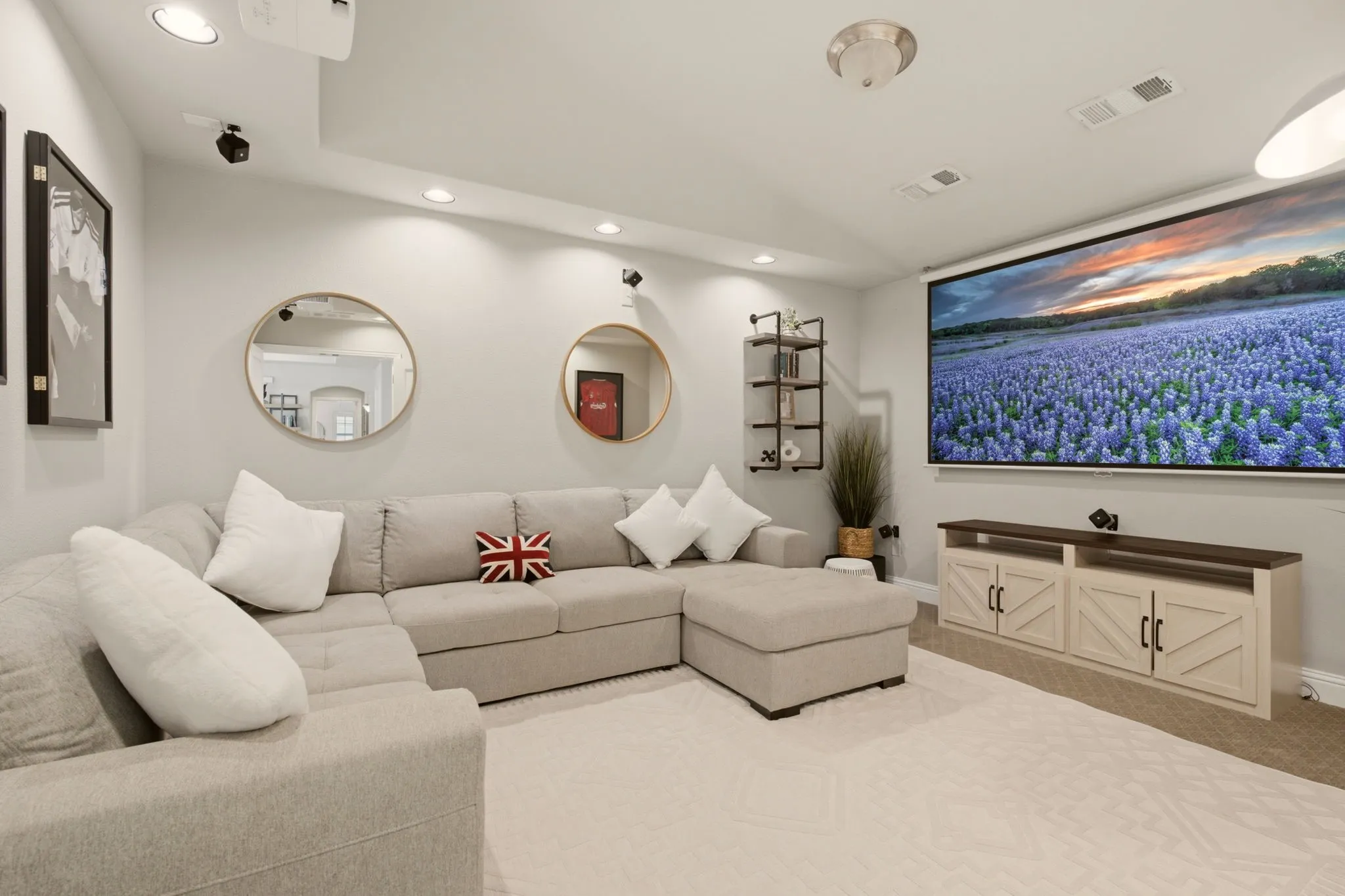 A favorite spot for the sellers & their family....this secluded media room with French doors. The layout is ideal for movie nights, sports watch parties, or relaxing with family & friends, while the enclosed design enhances the cozy, theater-like atmosphere.