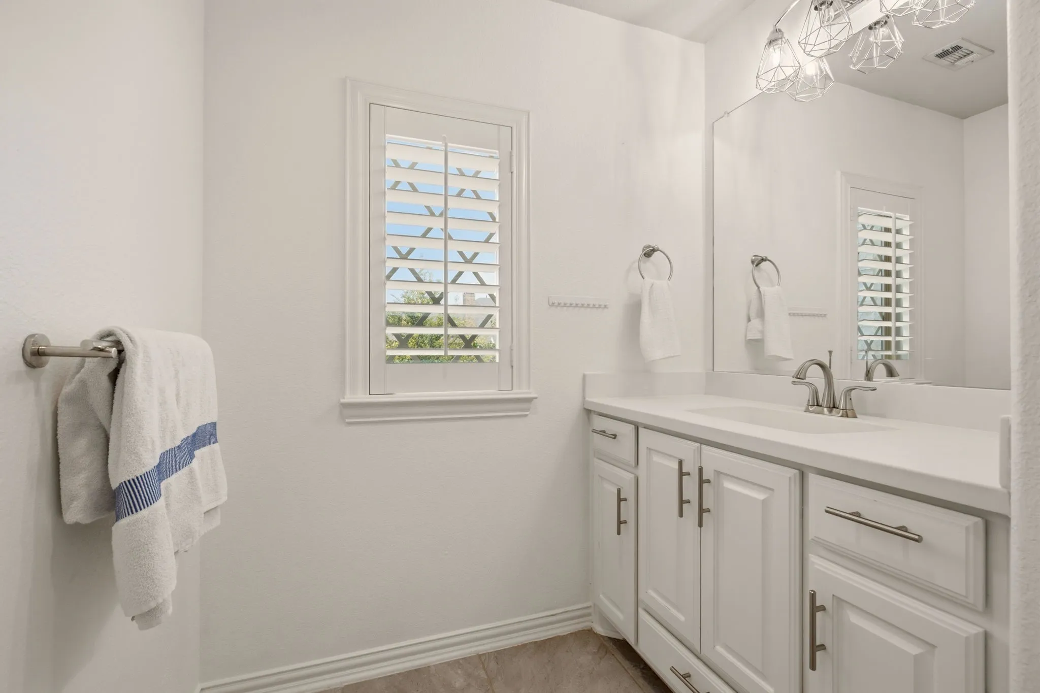 One of two vanities that connect between bedrooms 4 & 5. Sparkling clean!