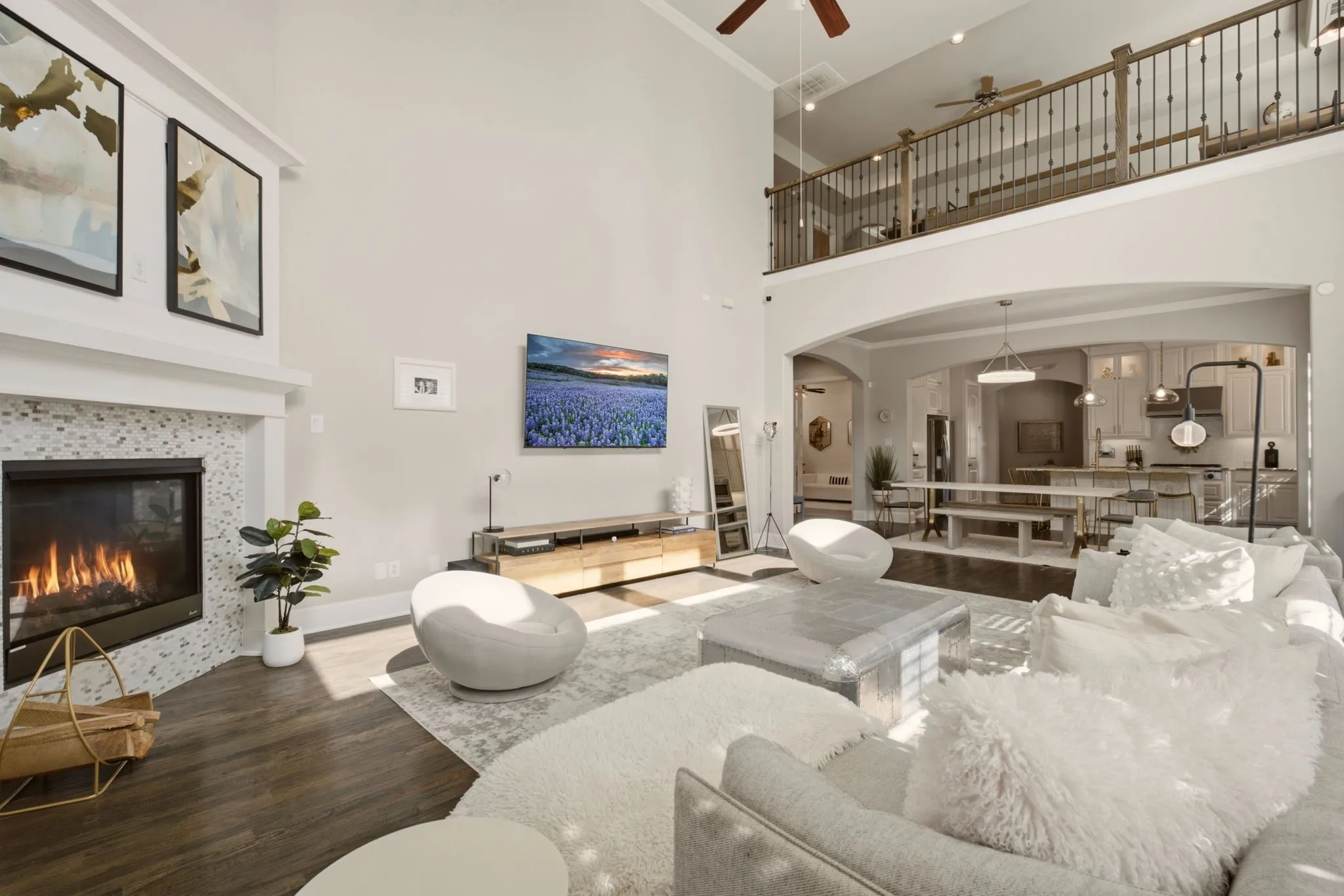 Flooded with natural light, this inviting gathering area seamlessly blends grandeur with comfort, making it equally suited for cozy evenings at home or entertaining family & friends.
