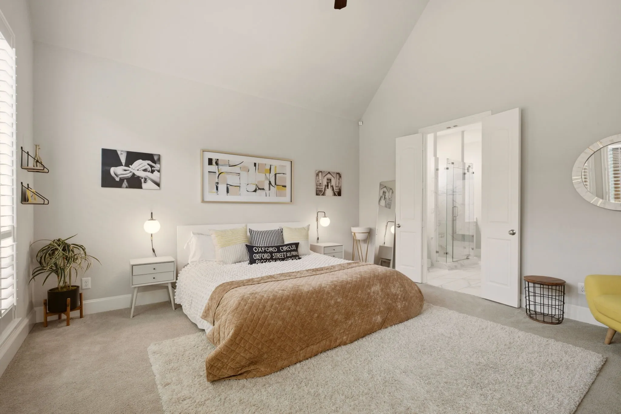 The primary bedroom is generously sized, with room for a comfortable sitting area, creating a classic retreat that’s perfect for relaxing. Note the vaulted ceiling for tremendous natural light as well.