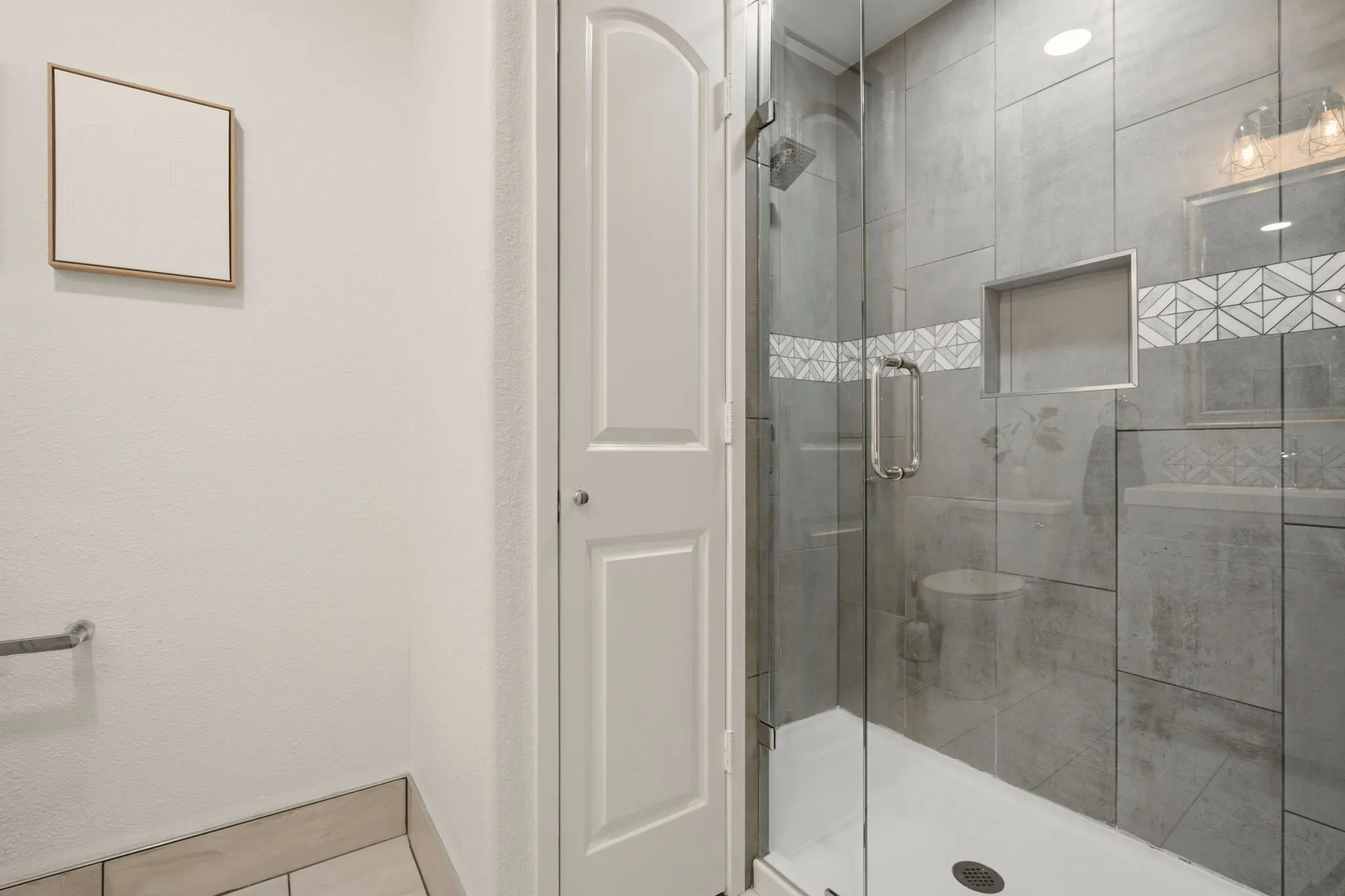 Ensuite bath to bedroom 2 has a walk-in shower.
