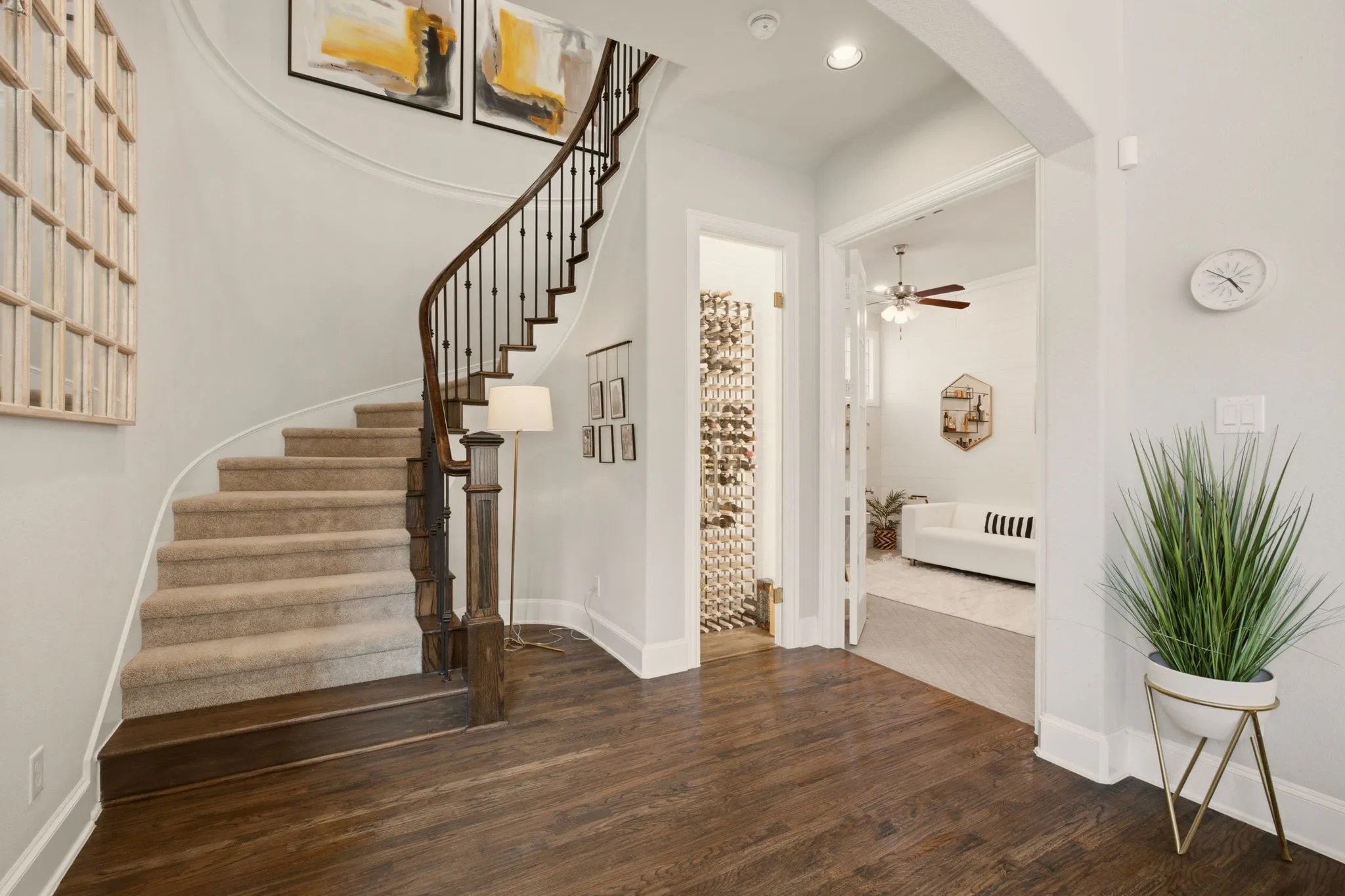 A sweeping staircase leads to the upper level, offering a spacious retreat with a game room, media room &three secondary bedrooms. Bedroom 5 to the right used as an office.