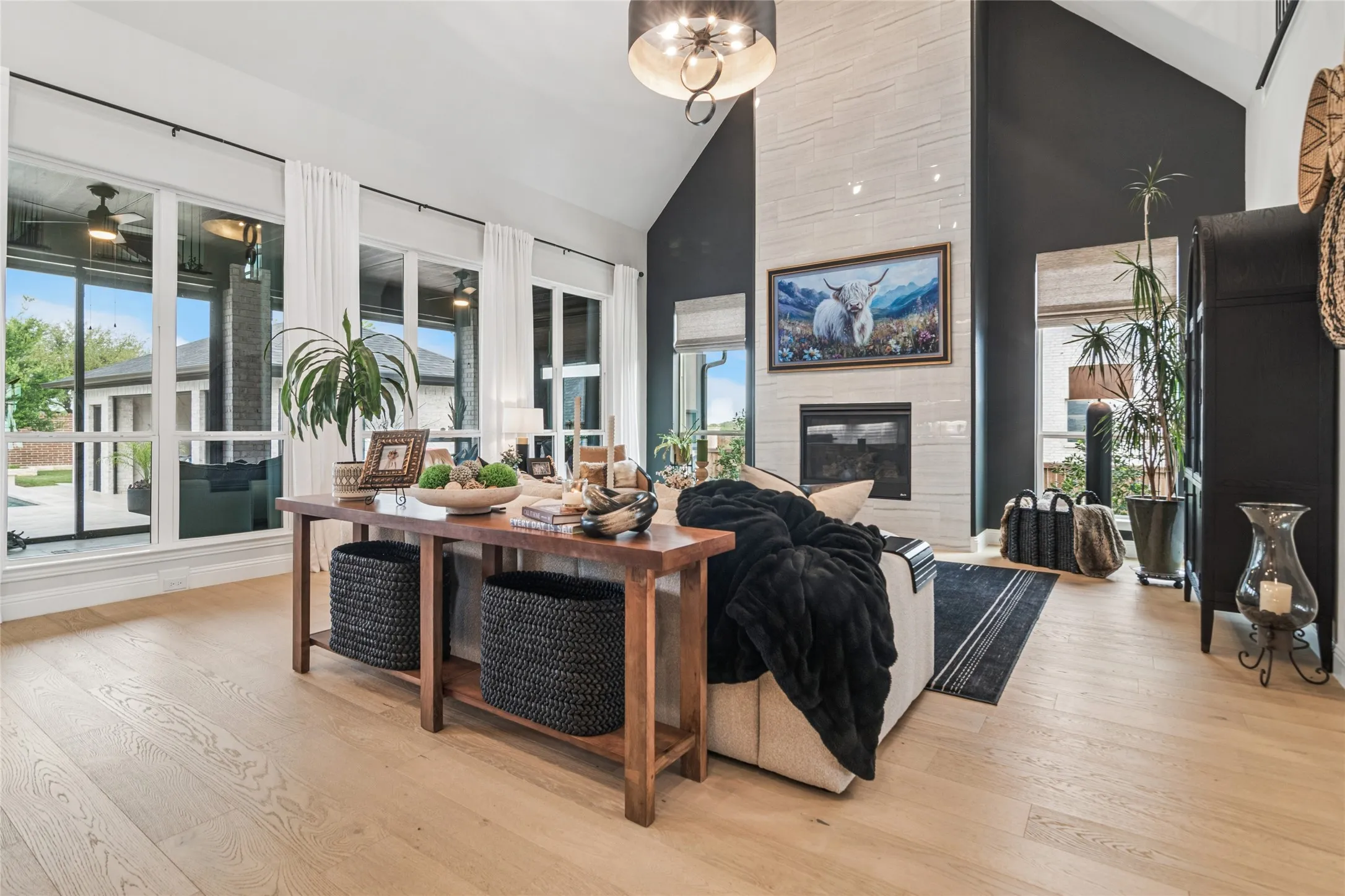 Custom light fixtures and ceiling fans throughout the home. Large plank wood flooring on the entire first floor and most of the upstairs. Custom window treatments, some motorized for ease of opening and closing. Large windows throughout allow so much natural light into the home.