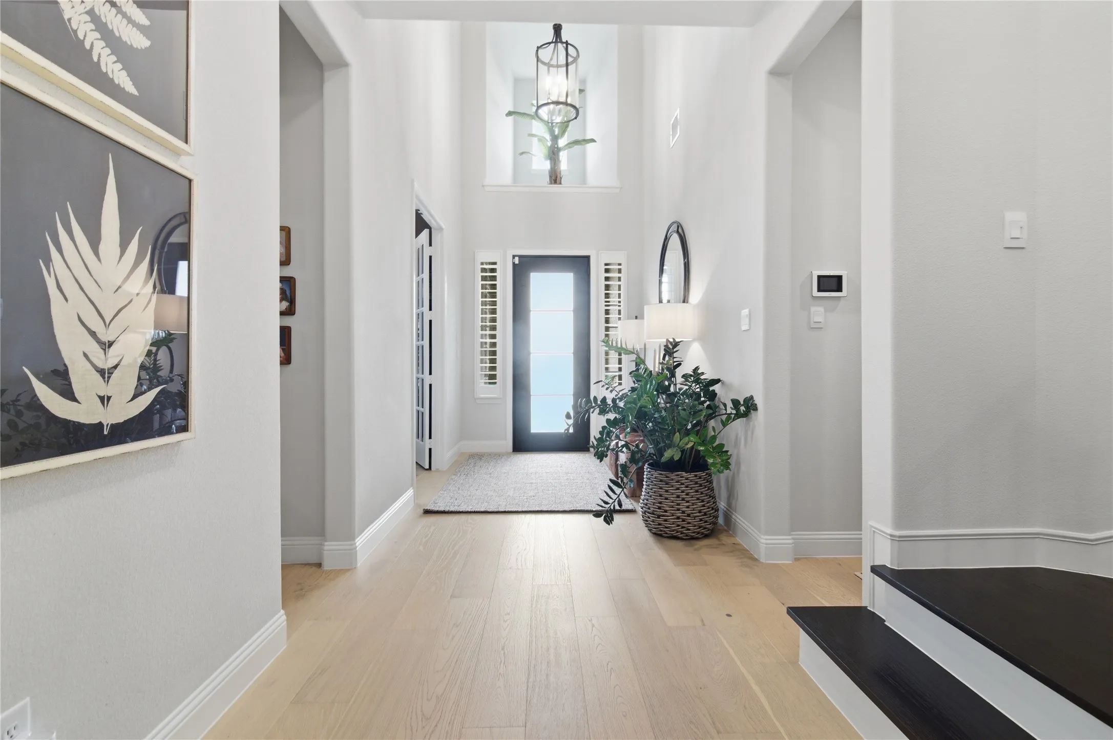 Iron glass front door with privacy glass, side windows, display niche above the door.
