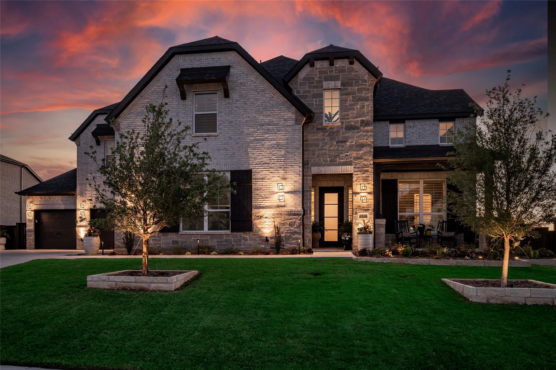 Meticulously maintained yard and home, custom lighting at the exterior.