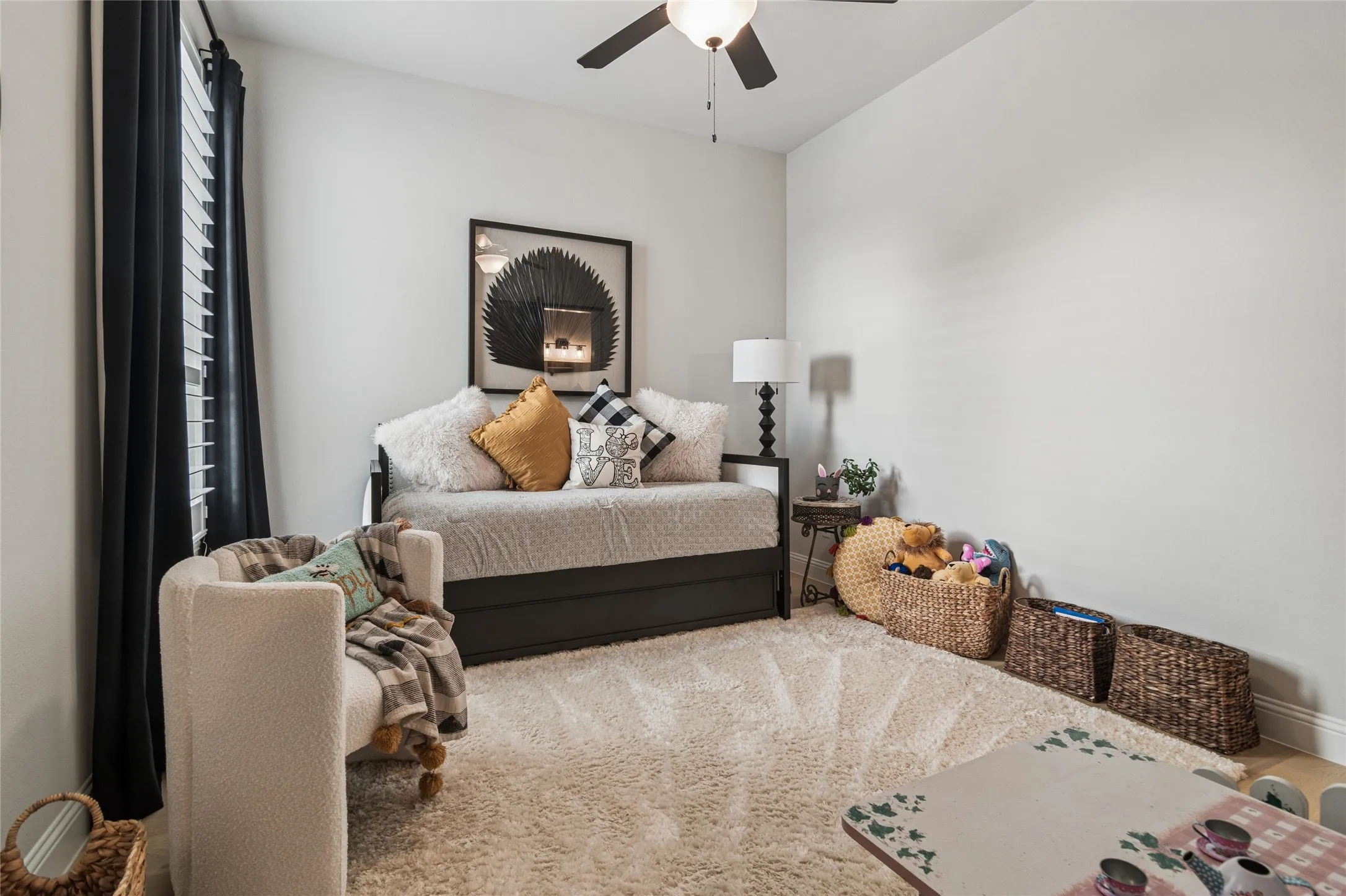 2 car garage entry near this bedroom with cubbies in the hall. Guest suite has large walk in closet with en suite bathroom.
