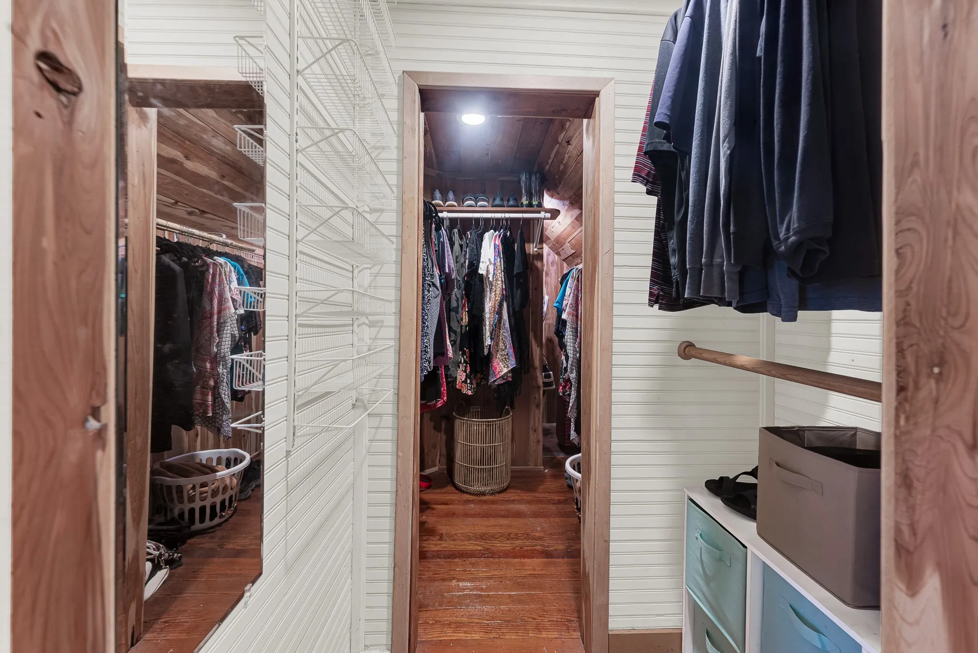 The spacious cedar-lined walk-through closet is a rare feature for a home of this era, offering generous storage while preserving its timeless character. Start each day with everything neatly organized and enjoy a dressing space that's as functional as it is inviting.