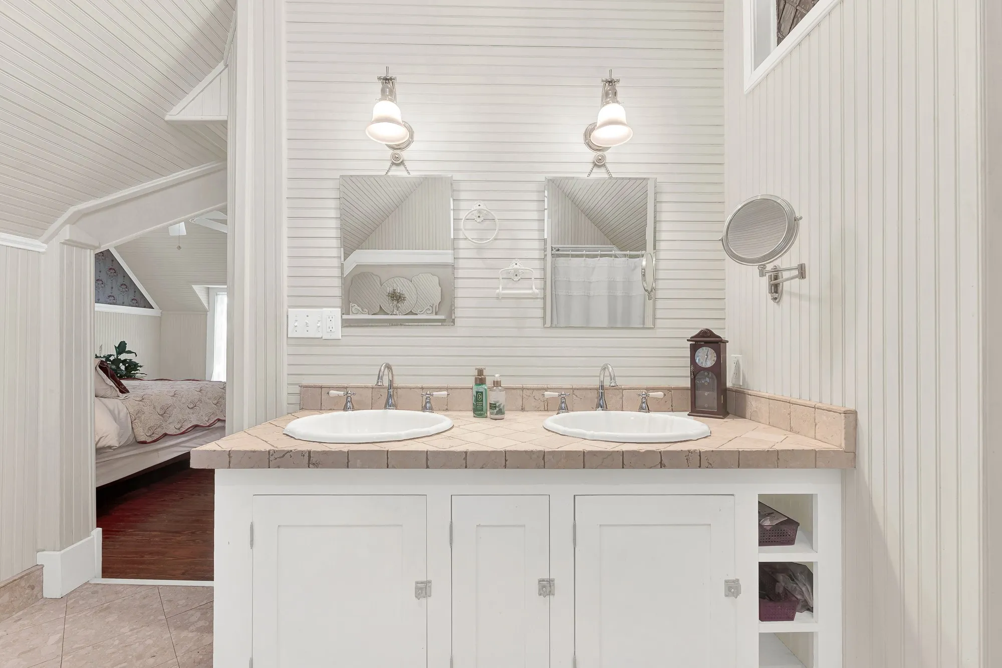 Dual vanities framed by crisp beadboard walls offer classic styling with the convenience of a thoughtfully updated design. Mornings flow with ease when everyone has their own space to prepare for the day.