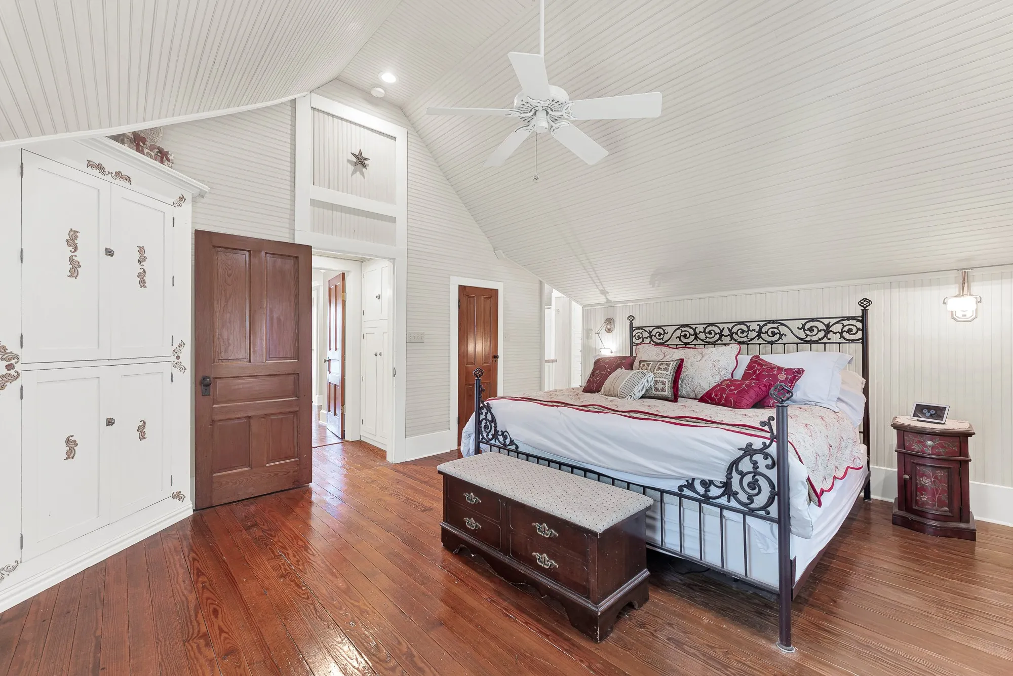 Vaulted beadboard ceilings and beautifully restored original hardwood floors create an airy retreat that blends historic character with the comfort of a thoughtfully rebuilt home. Wake to peaceful country views and end each day in a space that feels quiet, bright, and wonderfully relaxing.