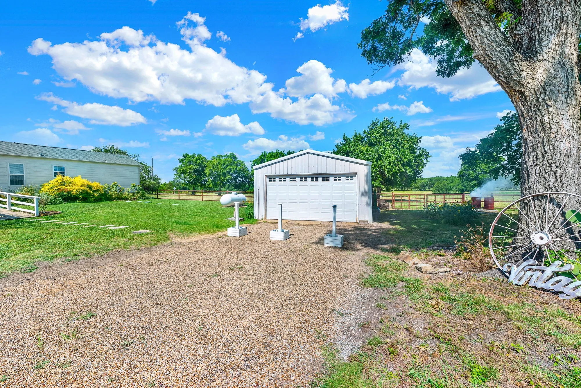 The 20' x 30' workshop is equipped with electricity and offers outstanding space for hobbies, woodworking, storage, or equipment. A roll-up garage door provides easy access, while the gravel drive and convenient location make it a practical addition for projects, business needs, or recreational use.