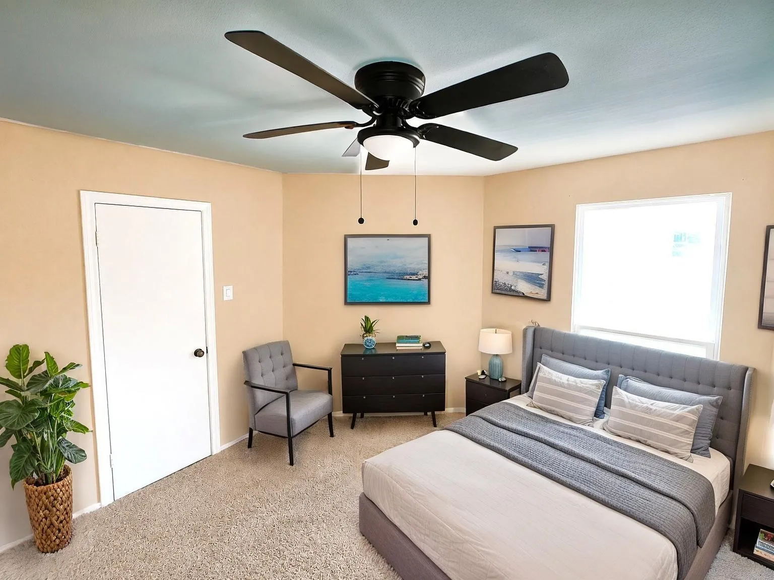 Virtually staged
Carpeted room featuring a ceiling fan with integrated lighting, a white panel door, and a single window with white trim
