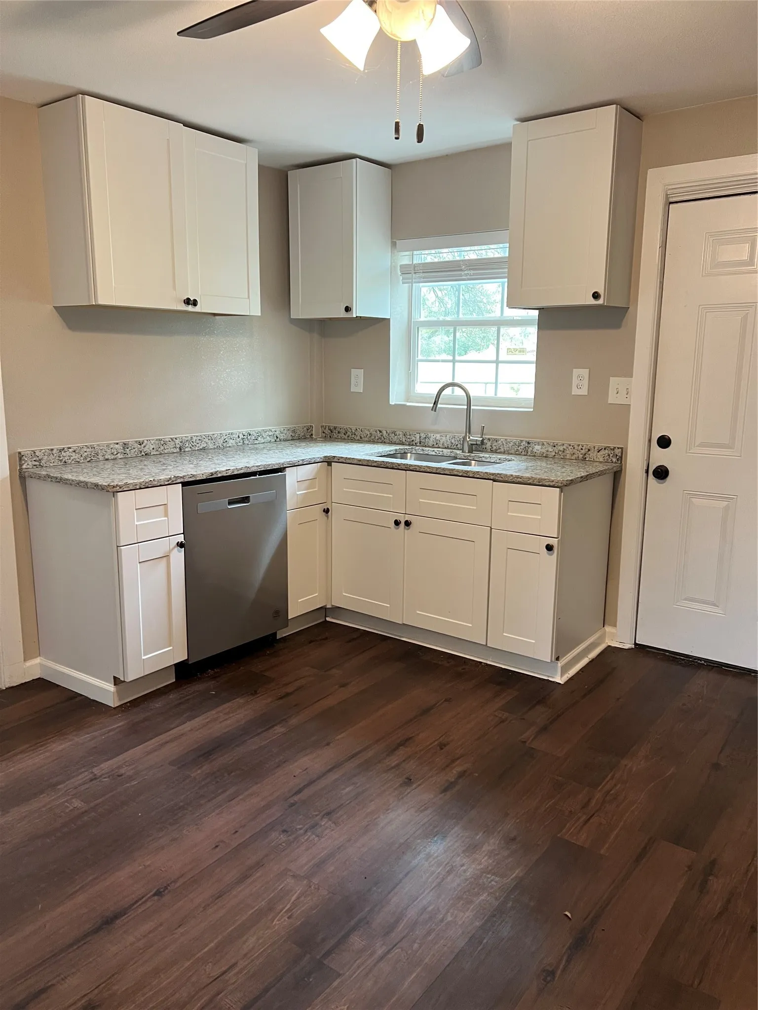 Brand new kitchen with stove, dishwasher, microwave and fridge.