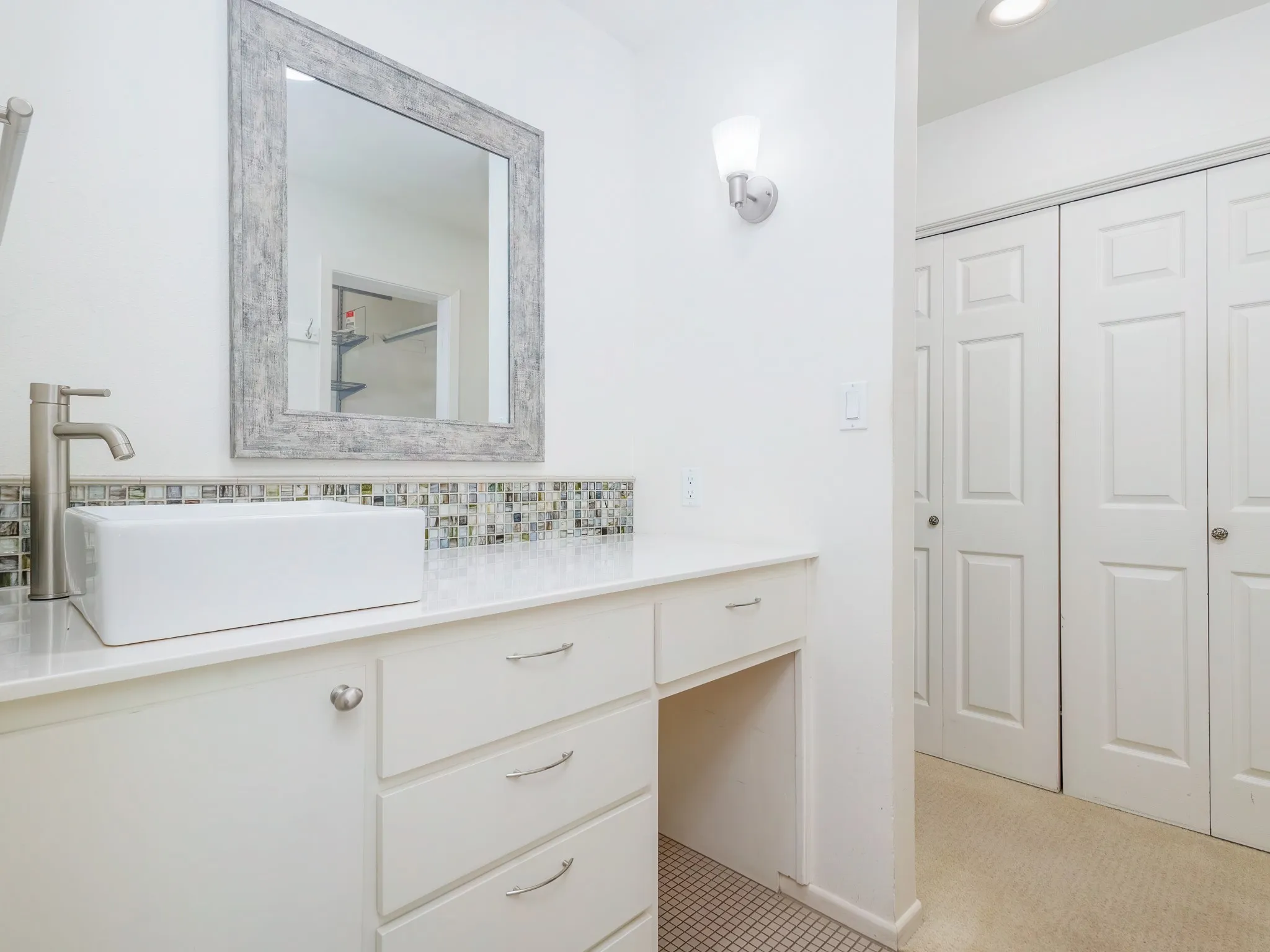 Second vanity in primary bathroom - doors are one of two closets