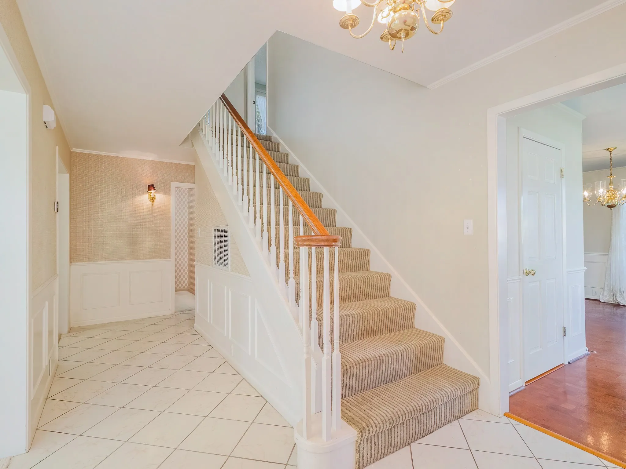 Stairs lead to three bedrooms and 2 bathrooms