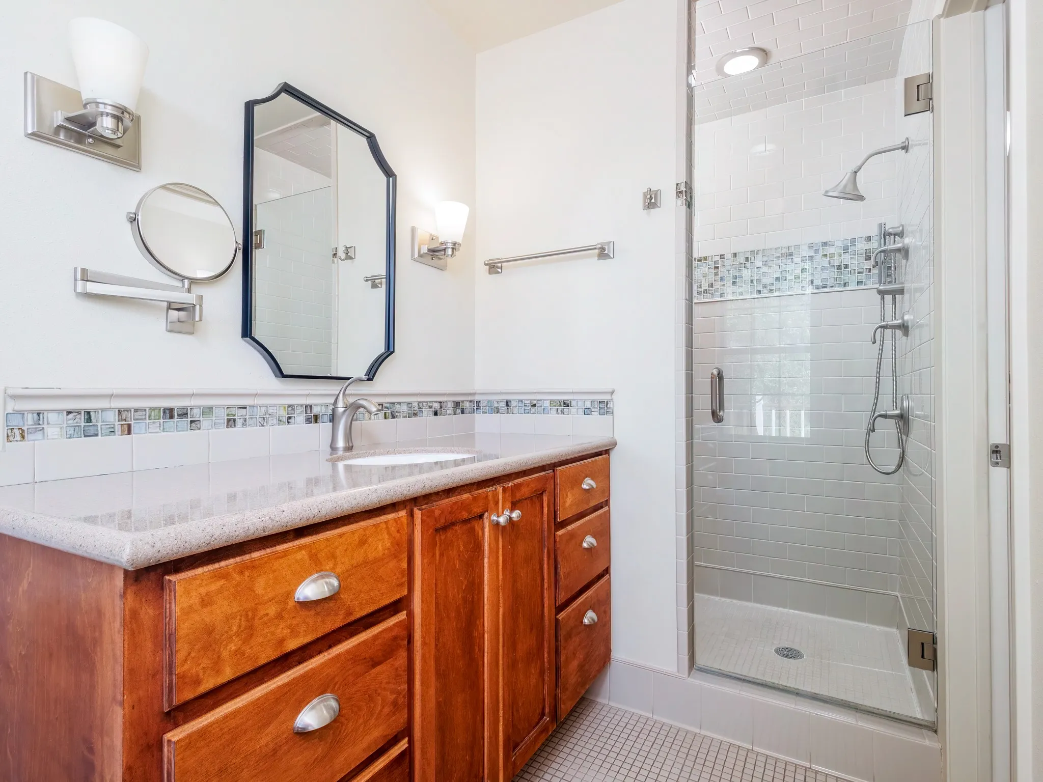 Offers a nice shower with separate vanities