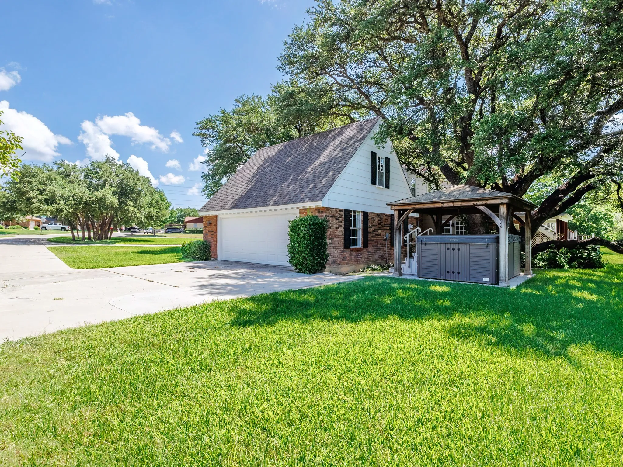 Oversized 2 car garage for storage & work area. Plus Master Spa Brand-swim spa with permanent cabana cover on concrete slab.