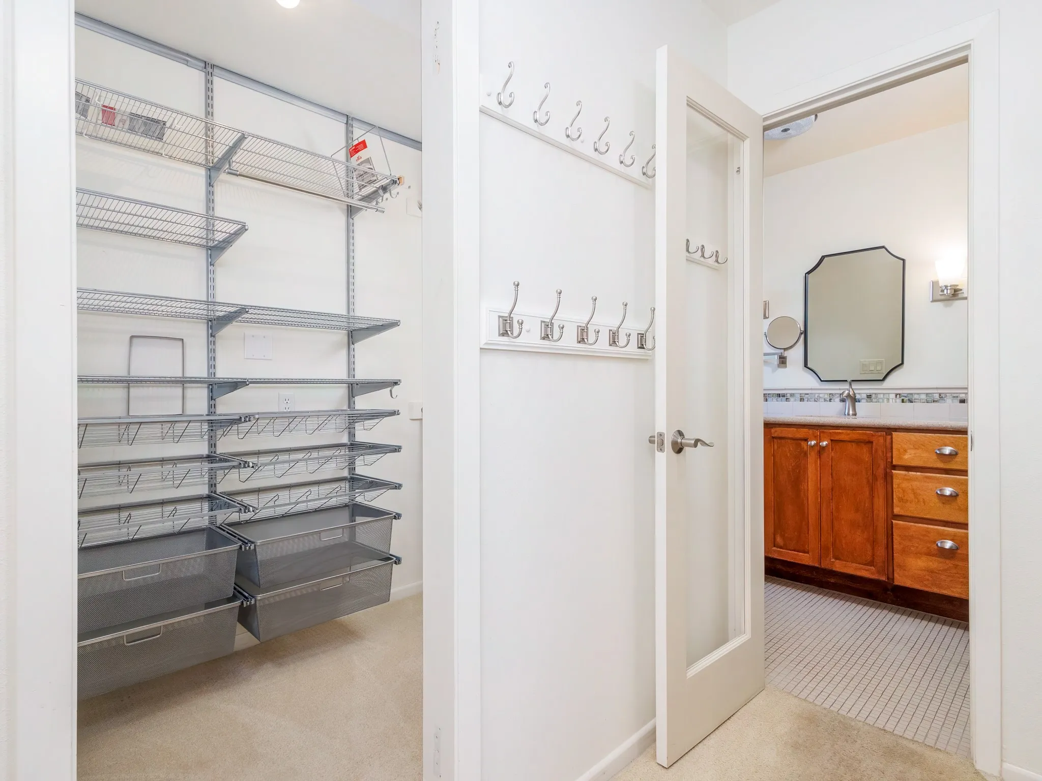 Primary bath offers two closets