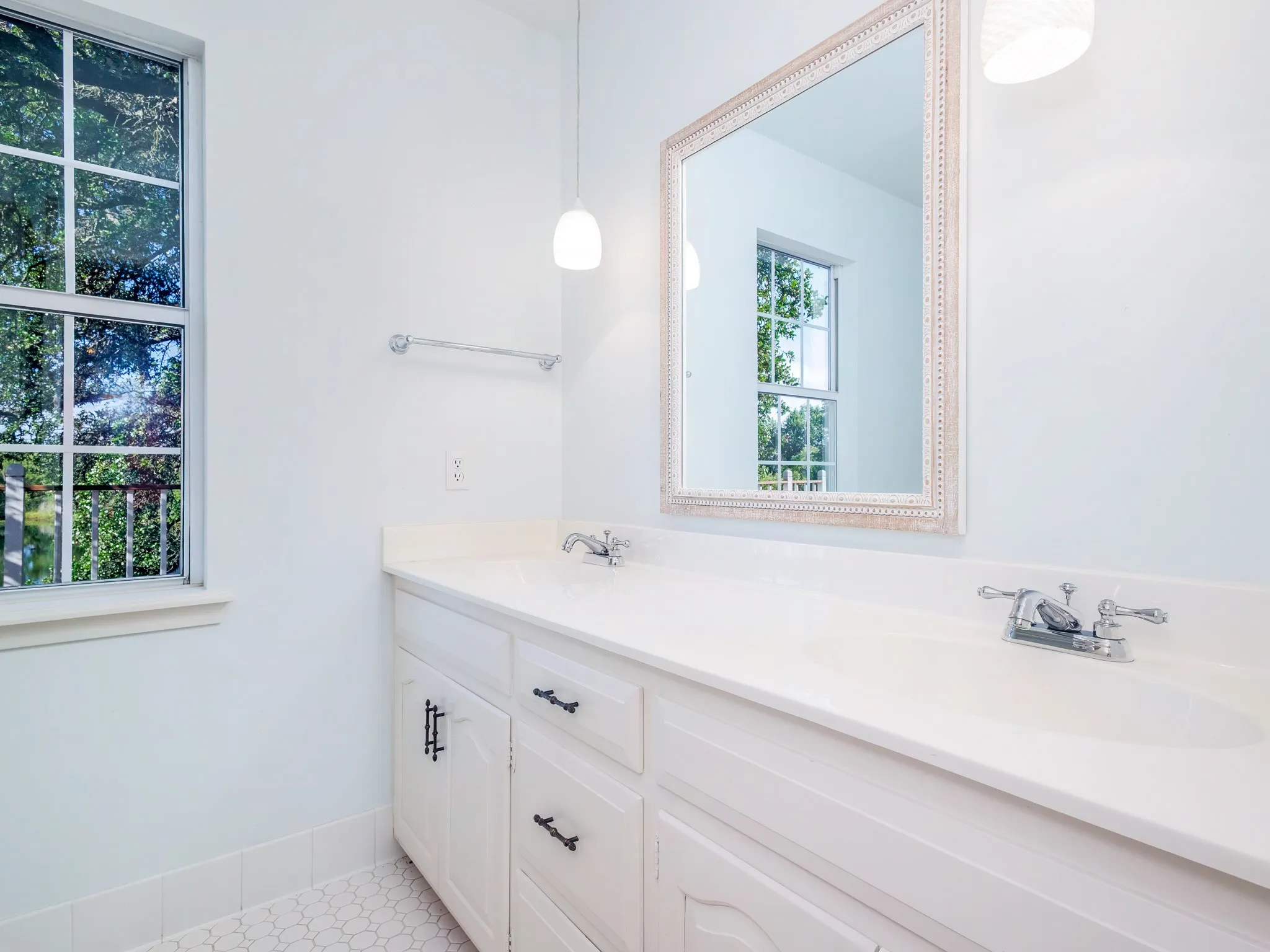 Main bath with two varieties plus view of pond