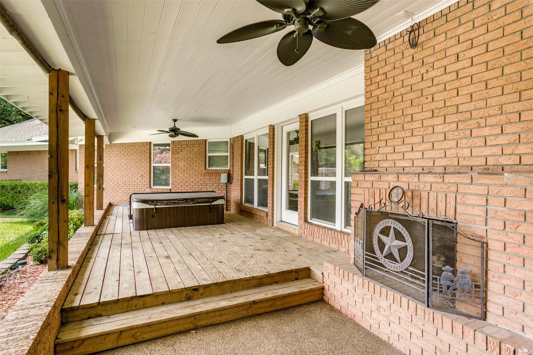 back patio, hot tub and outdoor fire place