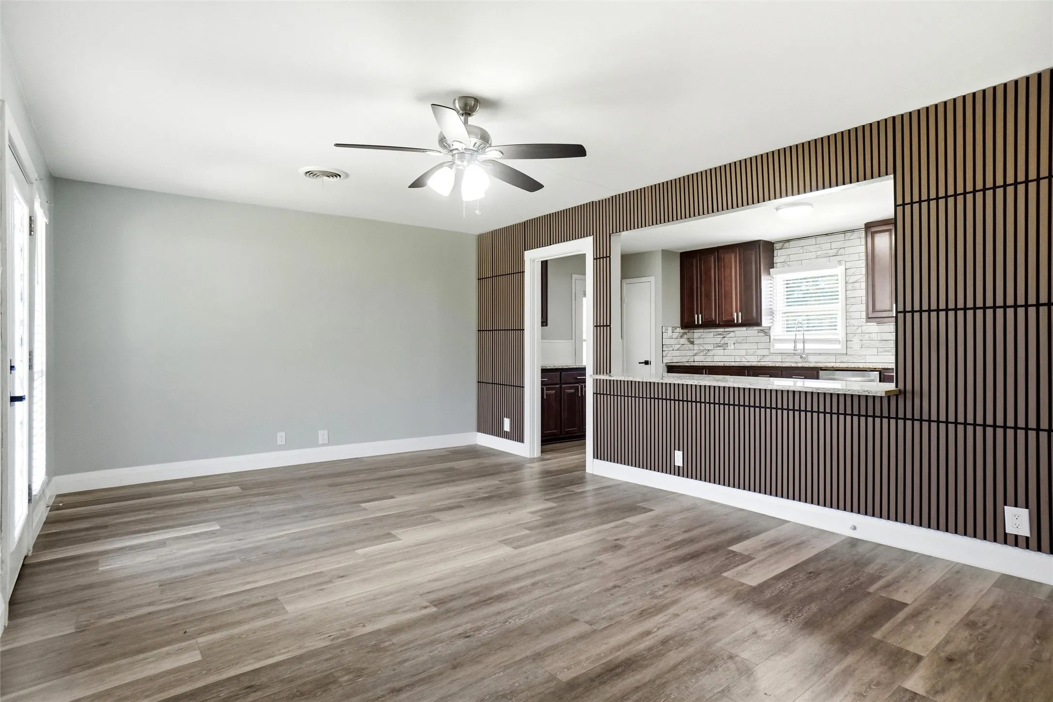 7ft acoustic panel accent peninsula bar opens from living into kitchen