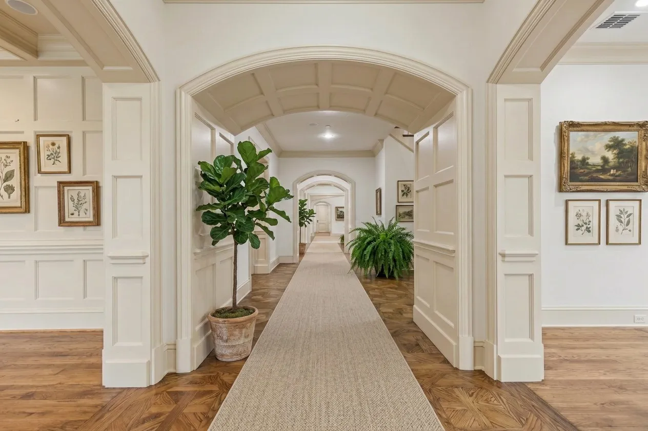 AI painted. Archway entrance with coffered ceiling, wainscoting, wood-finish flooring, and recessed lighting
