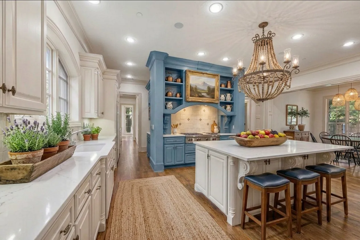 AI PAINTED- Kitchen featuring extensive white cabinetry, a large center island with seating, a blue-painted range hood with integrated shelving, recessed lighting, and wood-finish flooring