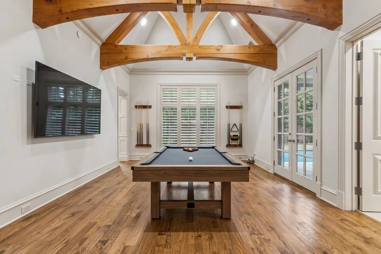 AI PAINTED Vaulted ceiling with exposed wood beams, wood-finish flooring, recessed lighting, and French​​‌​​​​‌​​‌‌​‌‌​​​‌‌​‌​‌​‌​​​‌​​ doors